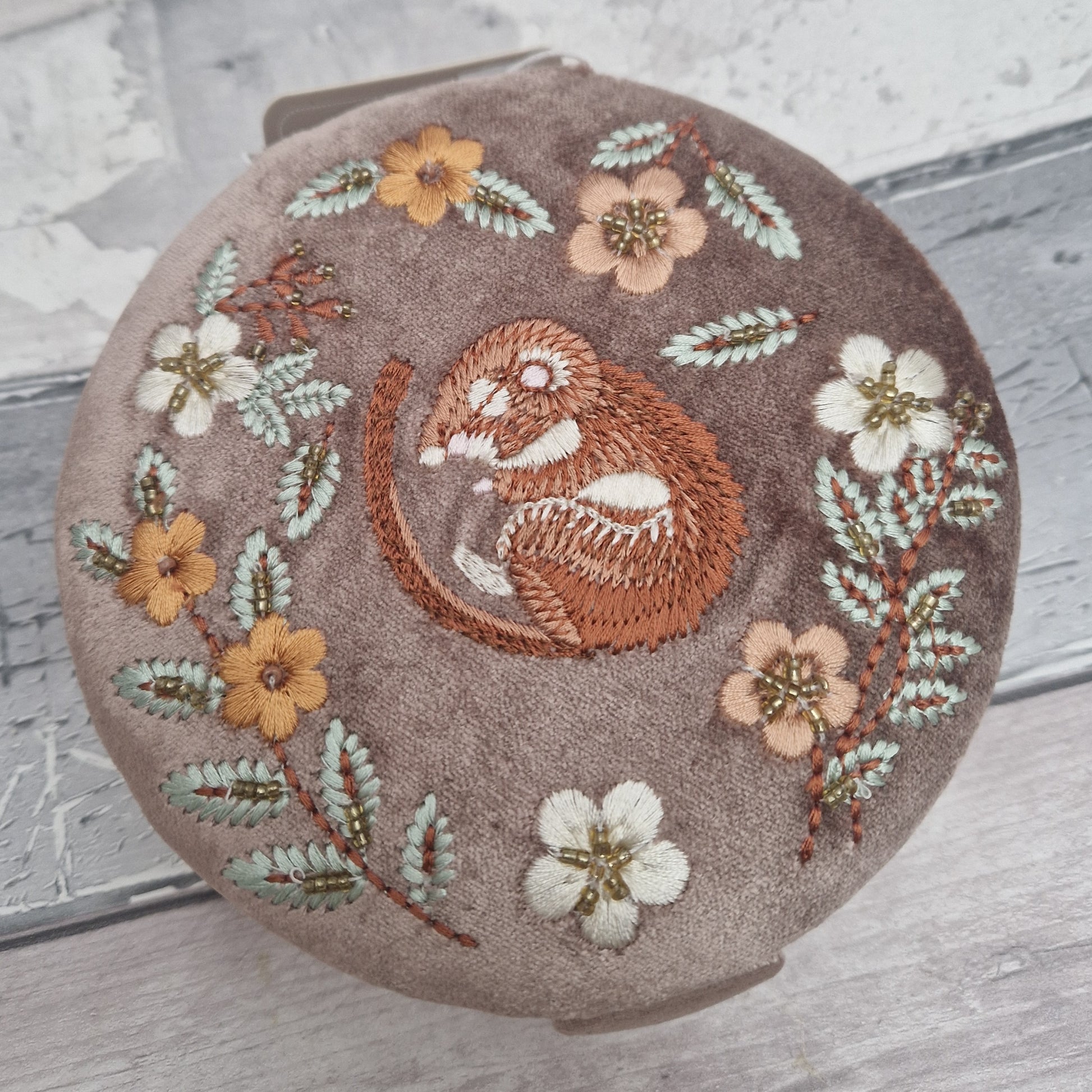 Buff Velvet Jewellery Box embroidered with a design of a dormouse asleep in amongst flowers and leaves.