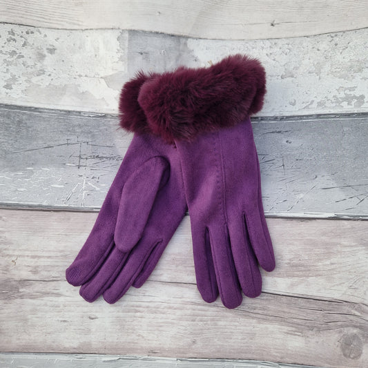 Purple coloured gloves with a faux fur trim and stitching detail down the back of the hand.