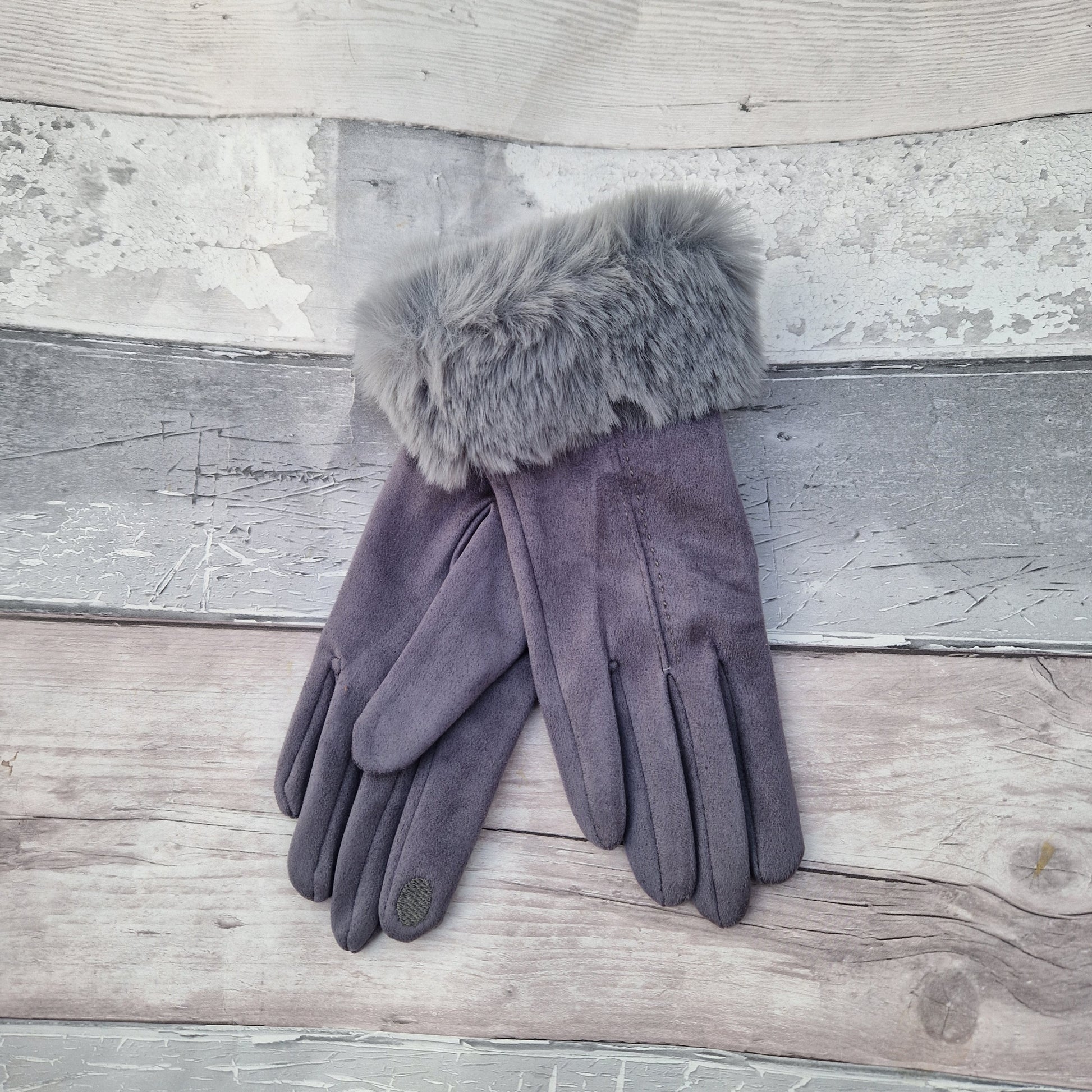 Silver Grey coloured gloves with a faux fur trim and stitching detail down the back of the hand.