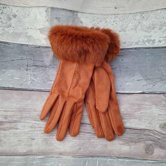 Orange coloured gloves with a faux fur trim and stitching detail down the back of the hand.