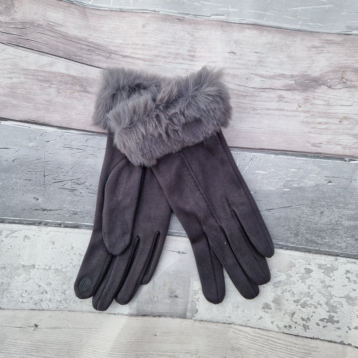 Dark Grey coloured gloves with a faux fur trim and stitching detail down the back of the hand.