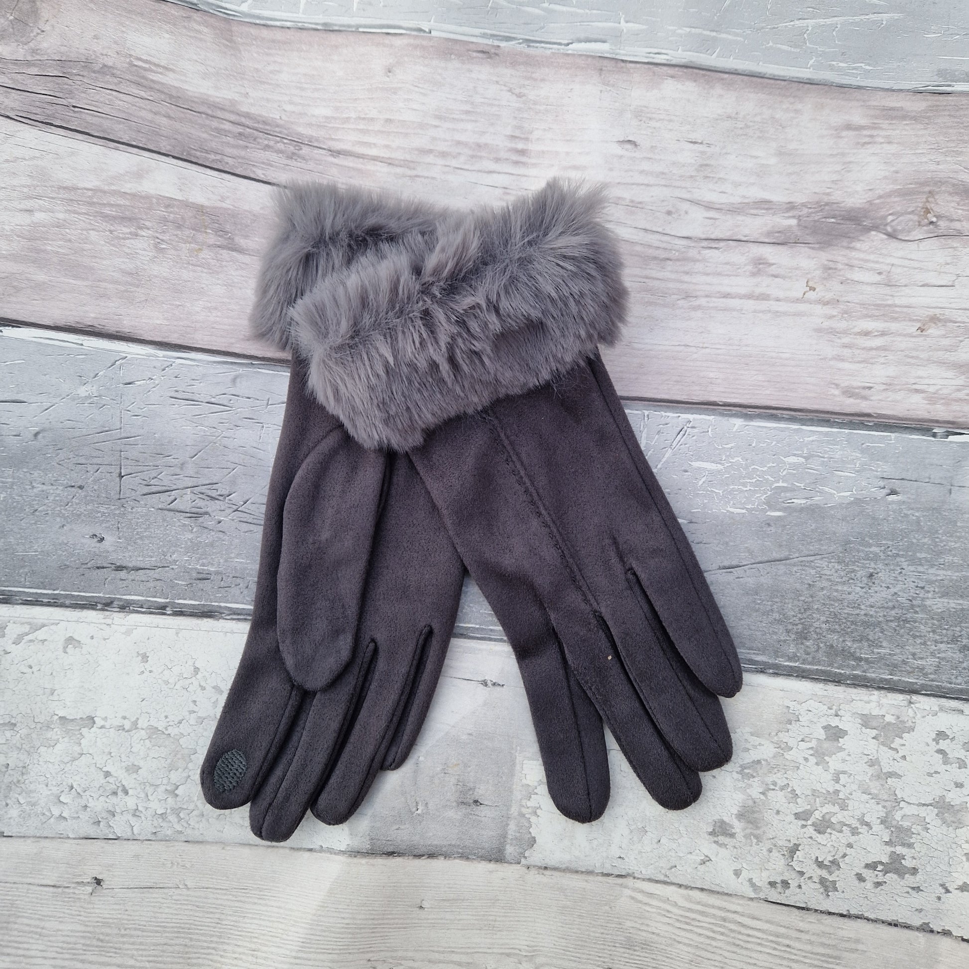 Dark Grey coloured gloves with a faux fur trim and stitching detail down the back of the hand.