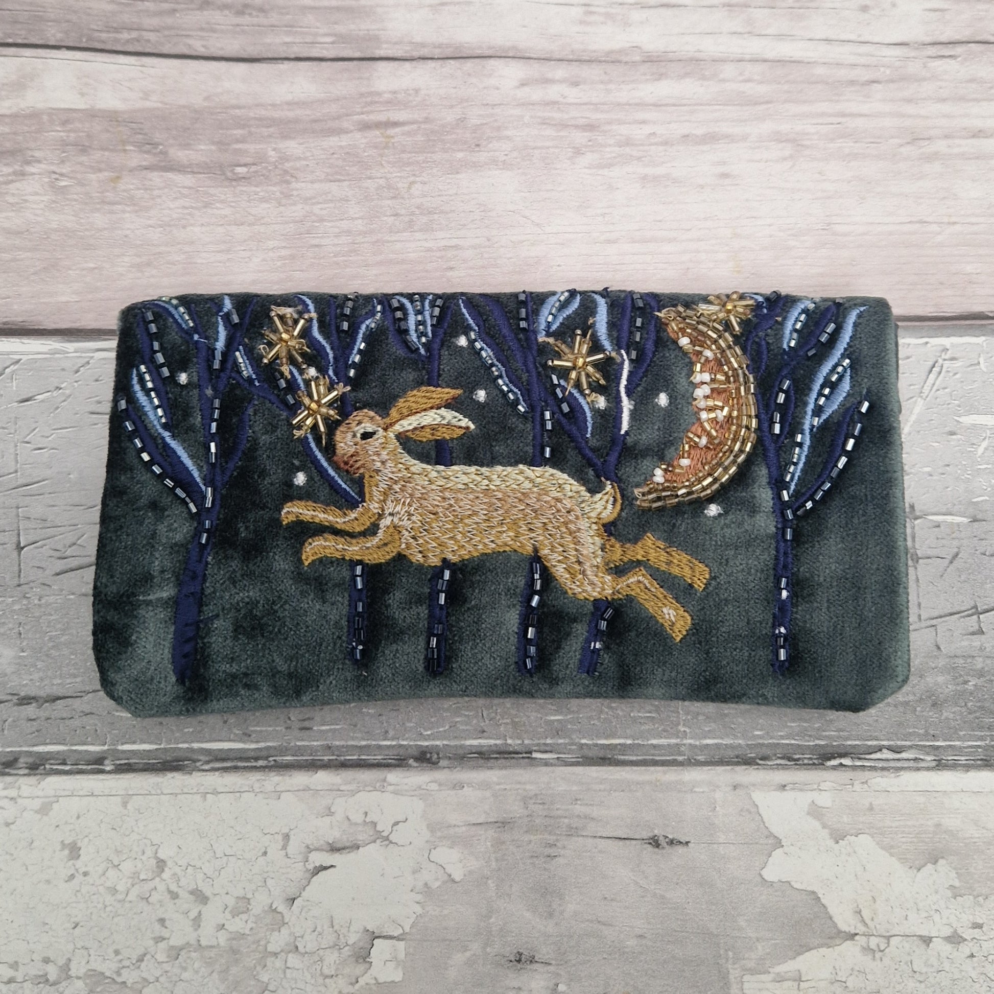 Velvet Jewellery Roll decorated with a hand embroidered image of hare running through woods on a moonlit night.