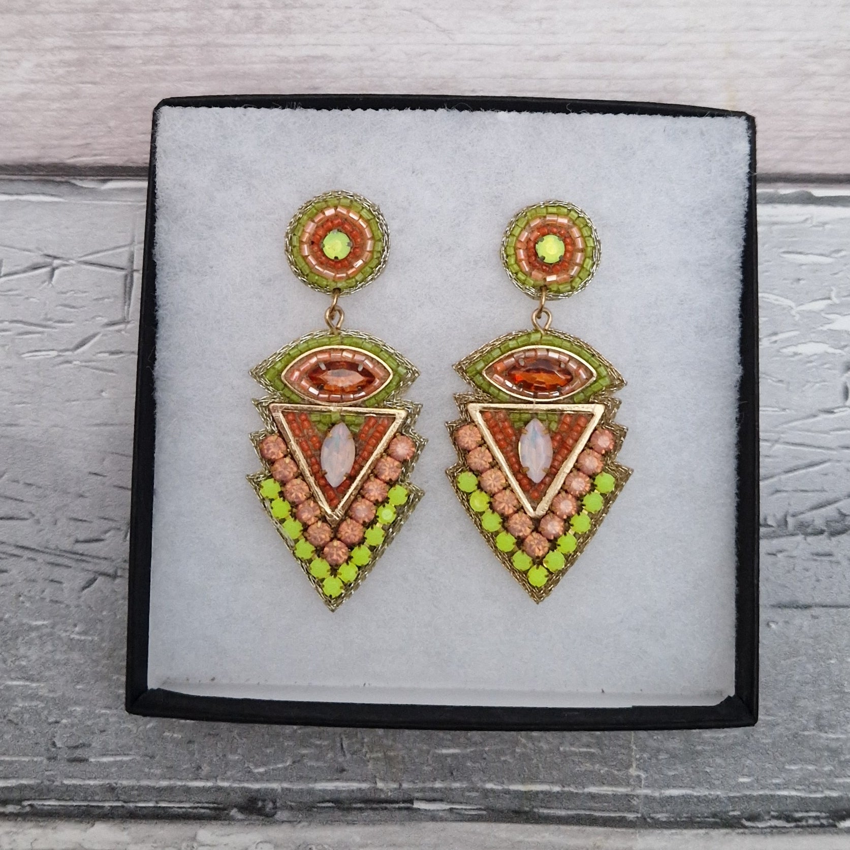 Lime and Orange Aztec inspired beaded drop earrings.