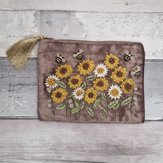 Brown velvet pouch decorated with embroidered sunflowers and dancing bees. Finished with hand sewn beading.
