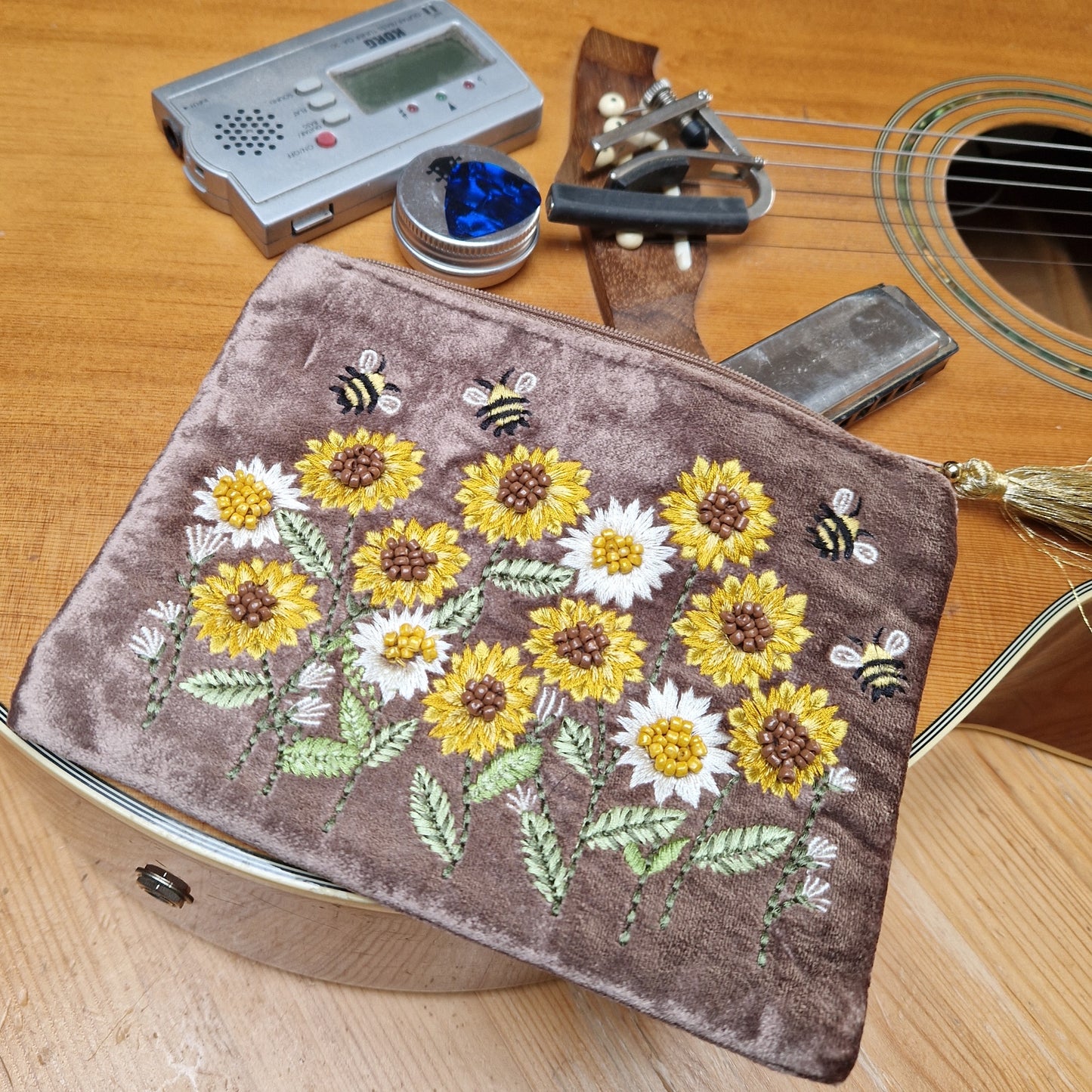 Brown velvet pouch being used to store musical equipment in.