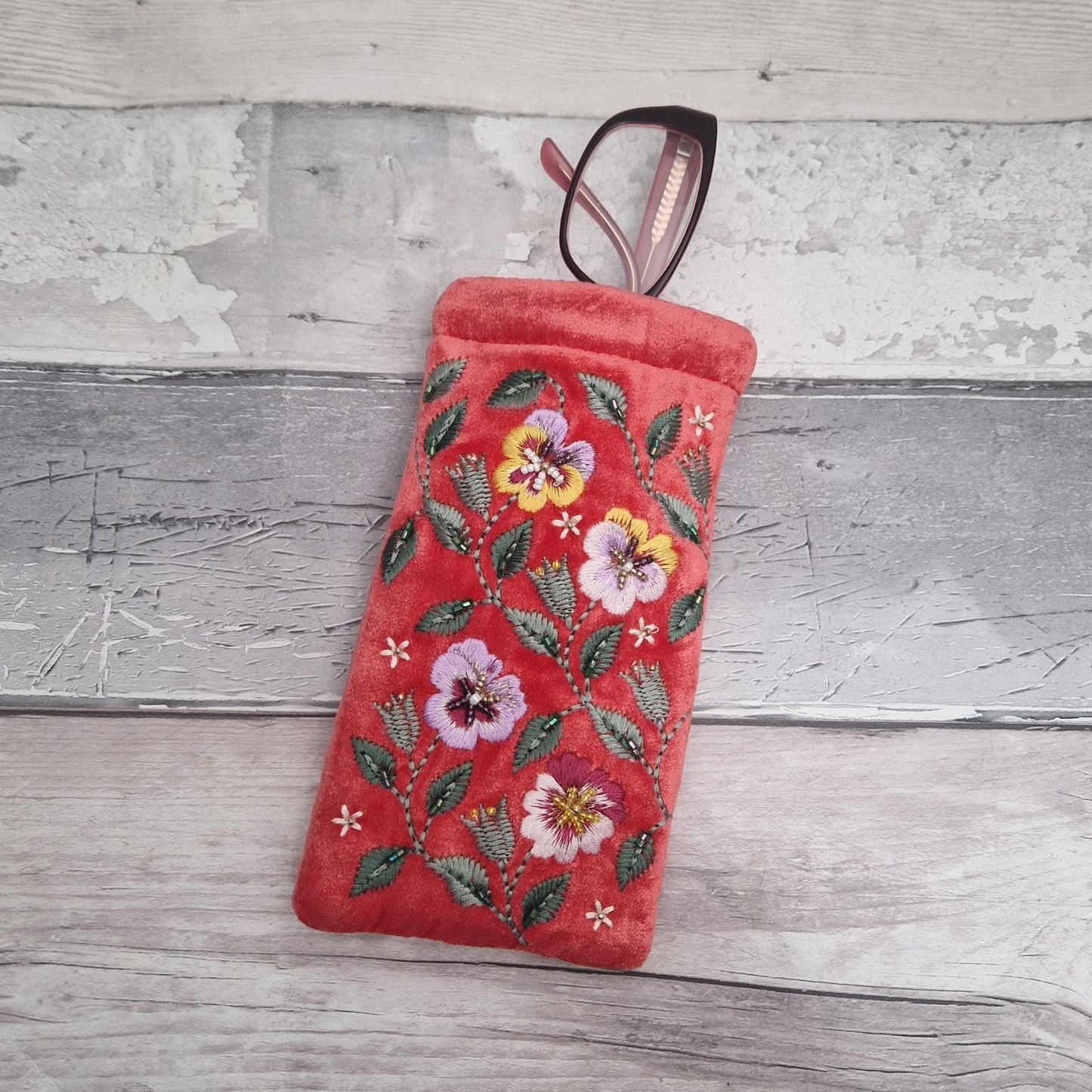 Salmon Pink Velvet glasses case decorated with embroidered purple and yellow pansies. Finished with intricately sewn beading.