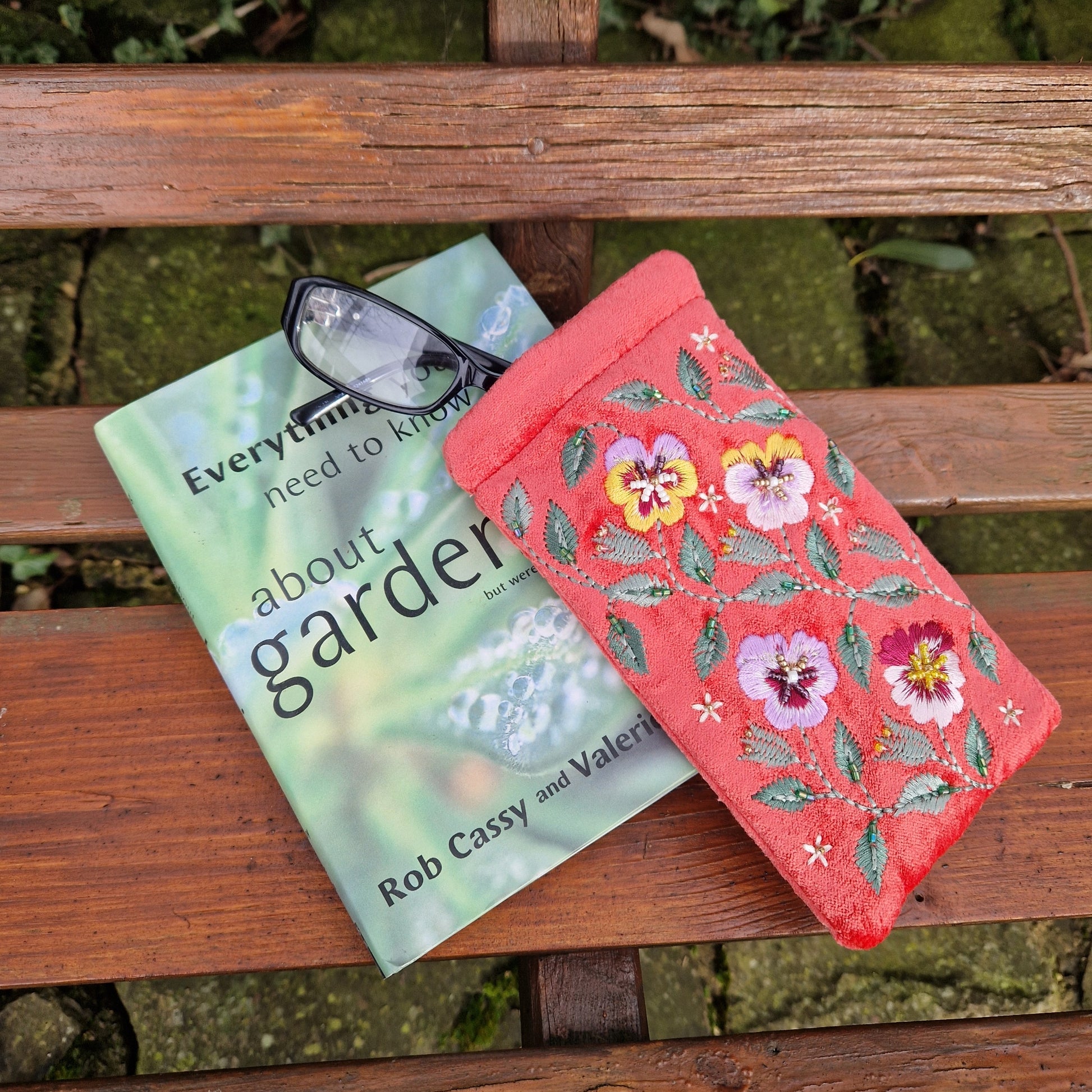Salmon Pink Velvet glasses case decorated with embroidered purple and yellow pansies. Finished with intricately sewn beading.