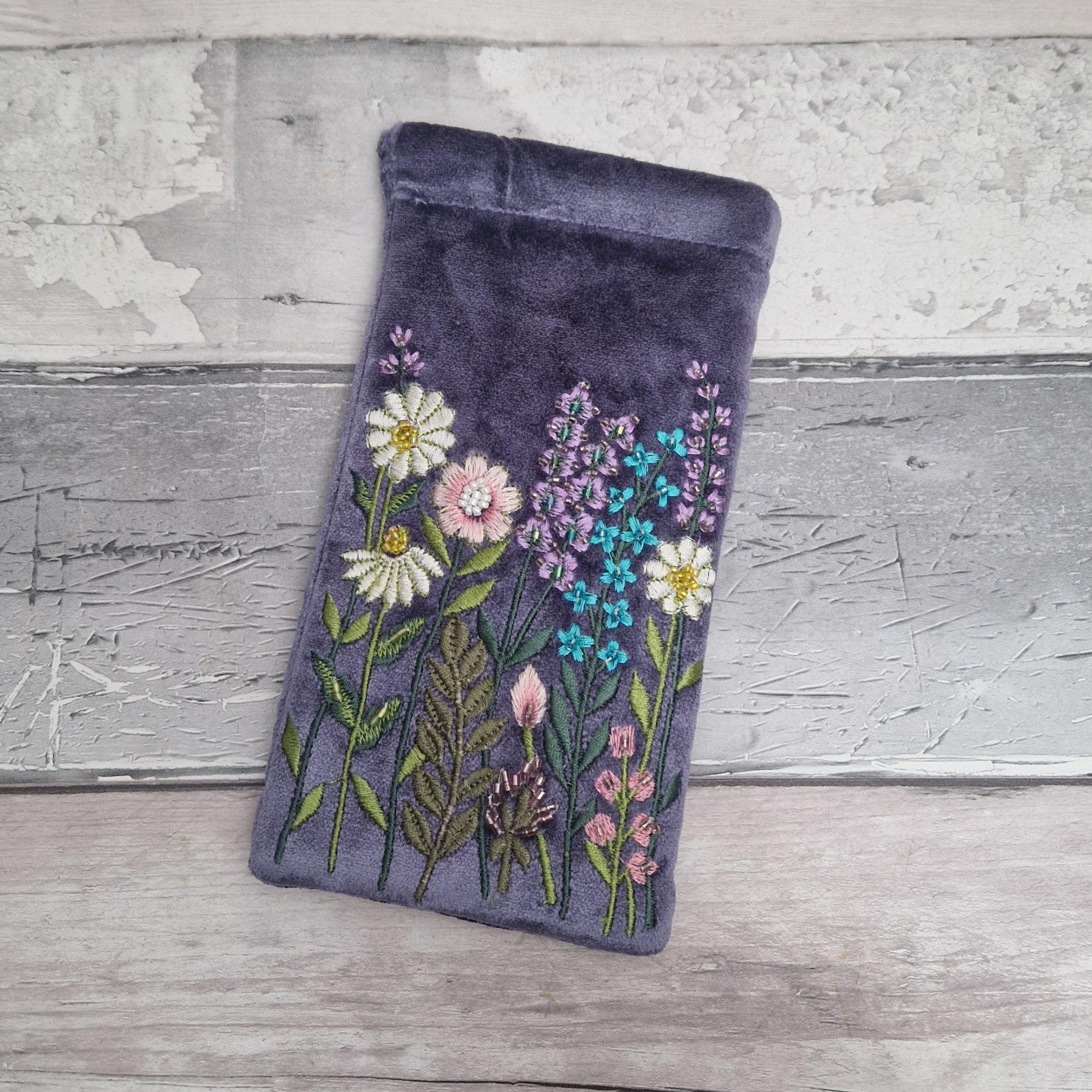 Lilac coloured velvet glasses case decorated with embroidered flowers and finished with hand sewn beads.