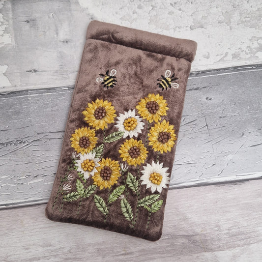 Brown coloured velvet glasses case decorated with embroidered sun flowers and bees. Finished with hand sewn beads.