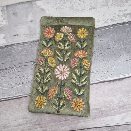 Green coloured velvet glasses case decorated with Gerbera flowers. Finished with hand sewn beads and metallic thread.