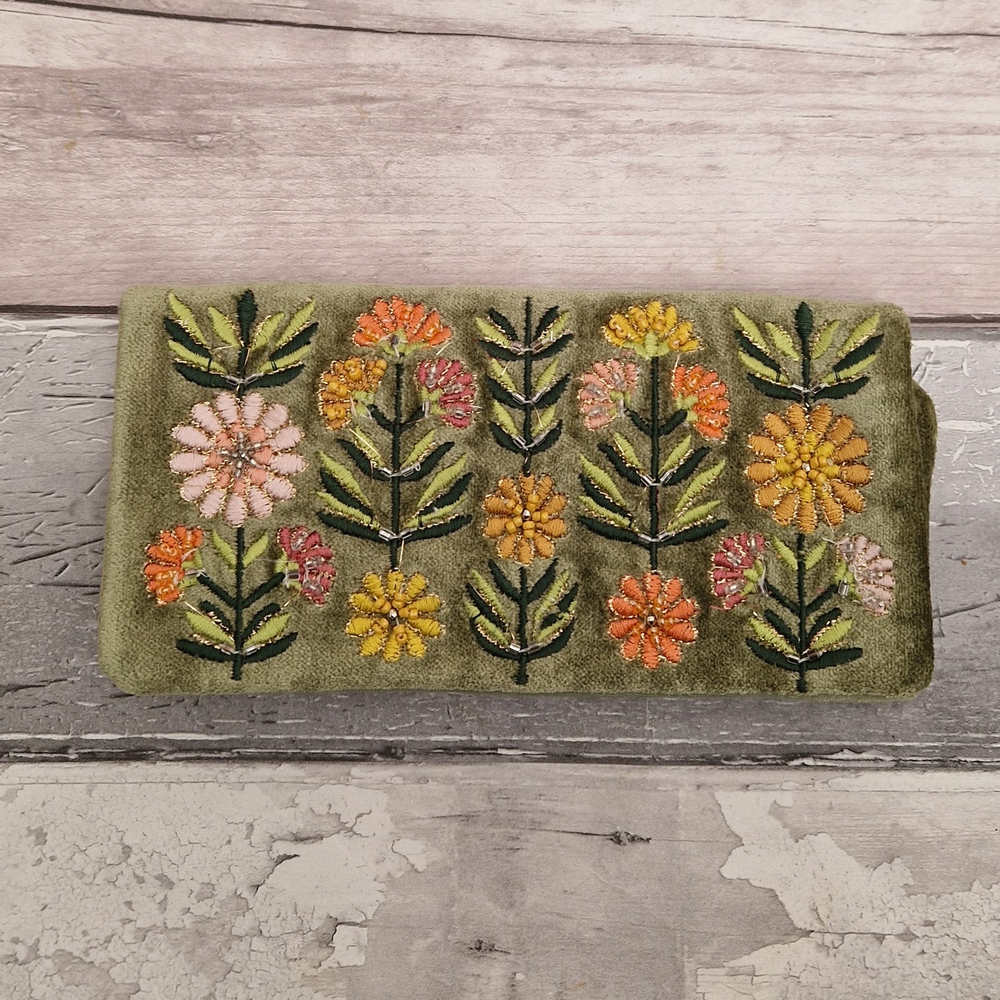 Green Velvet Jewellery Roll decorated with embroidered flowers finished with beading and metallic thread.
