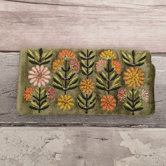 Green Velvet Jewellery Roll decorated with embroidered flowers finished with beading and metallic thread.