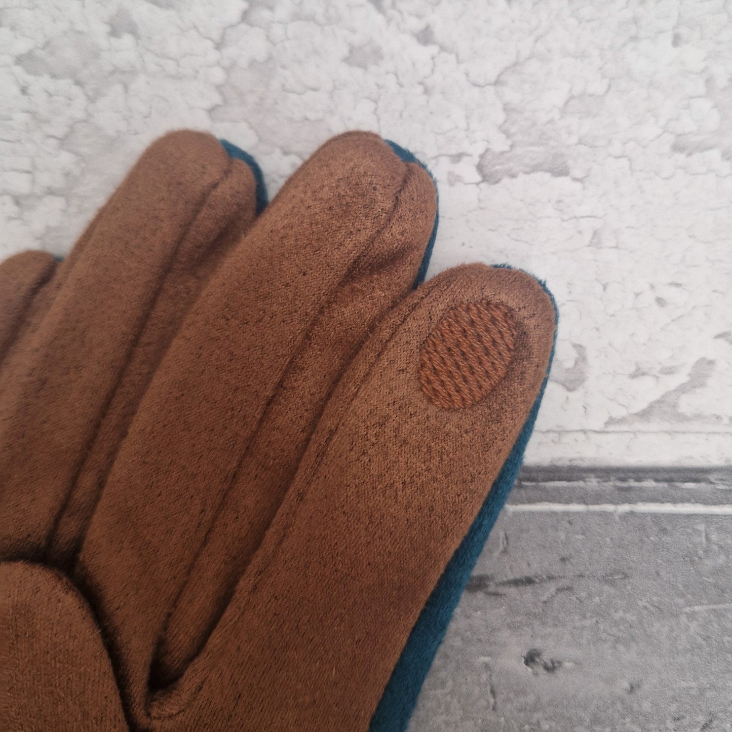 Cinnamon coloured gloves with a touch screen finger detail.