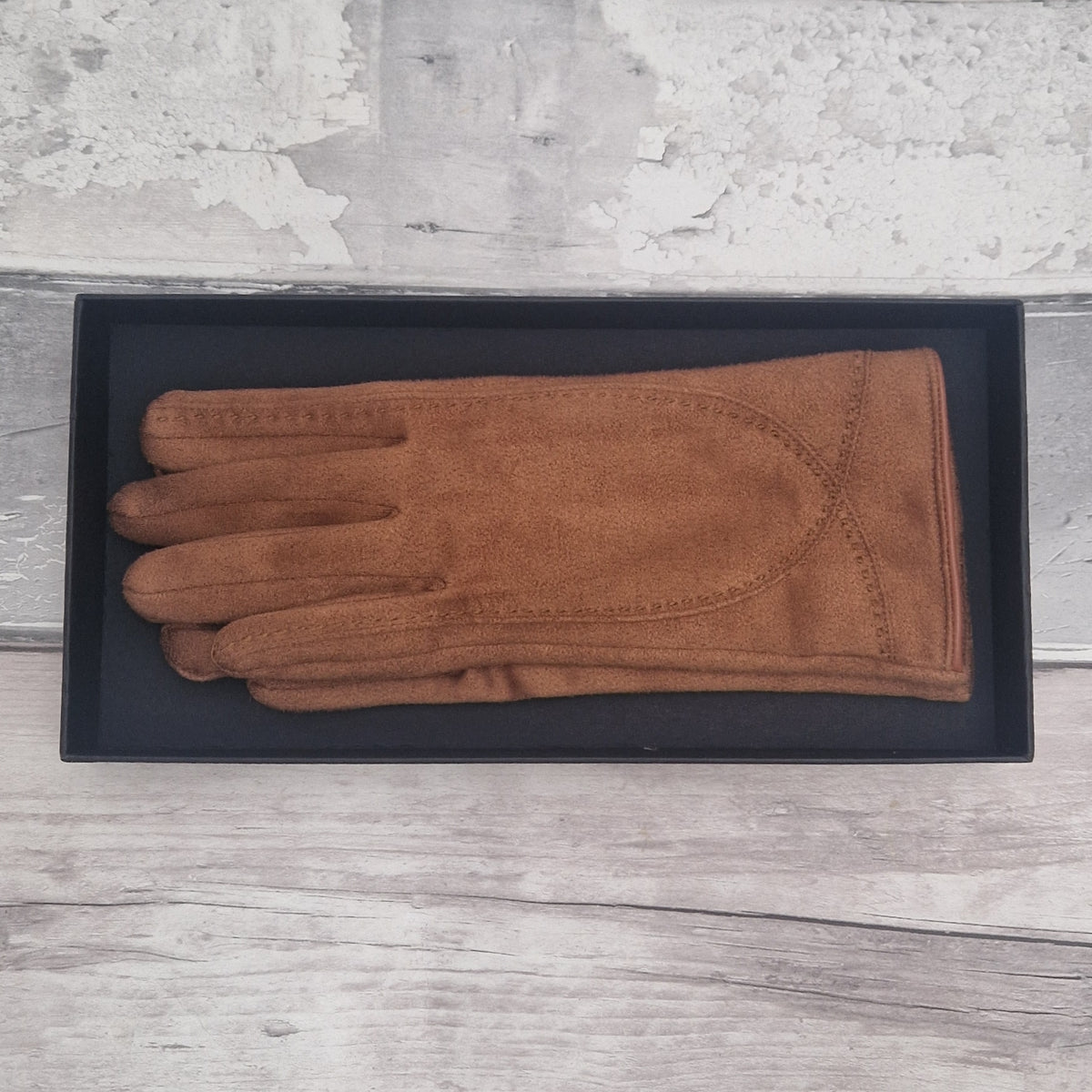 Brown suede feel glove in a black presentation gift box.