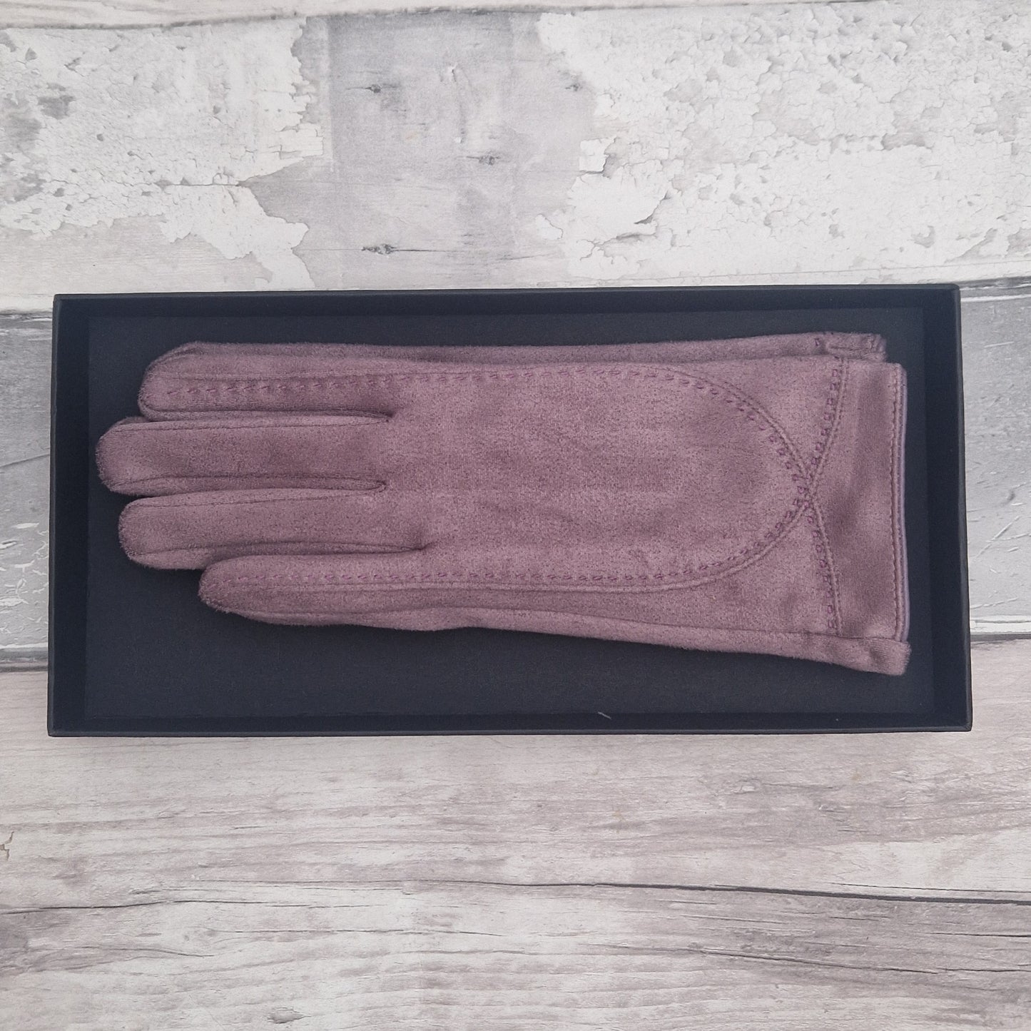 Lilac suede feel glove in a black presentation gift box.