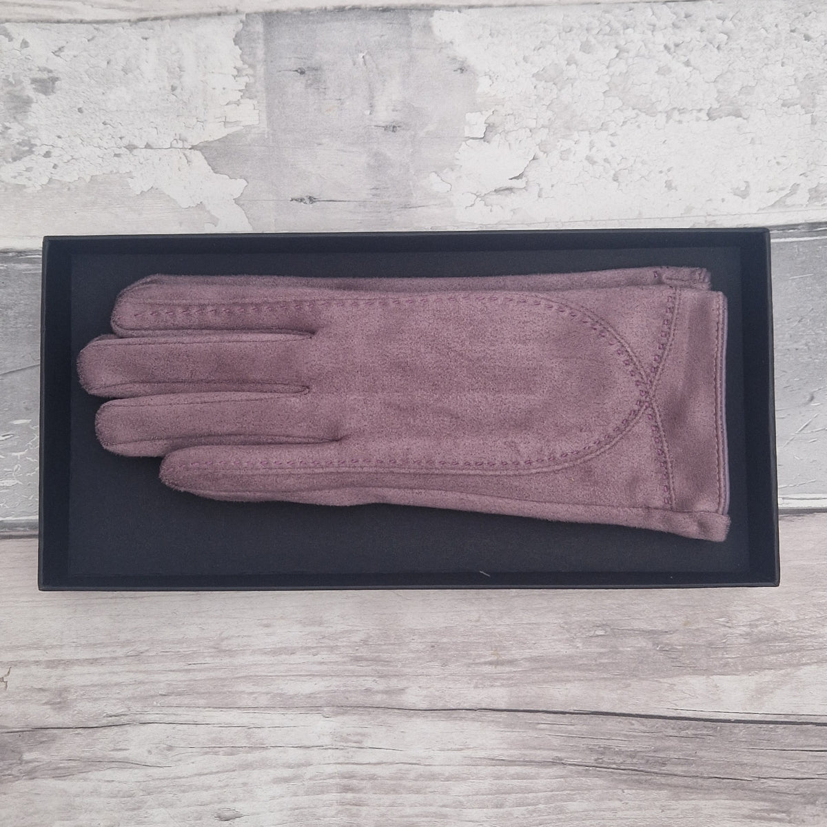Lilac suede feel glove in a black presentation gift box.