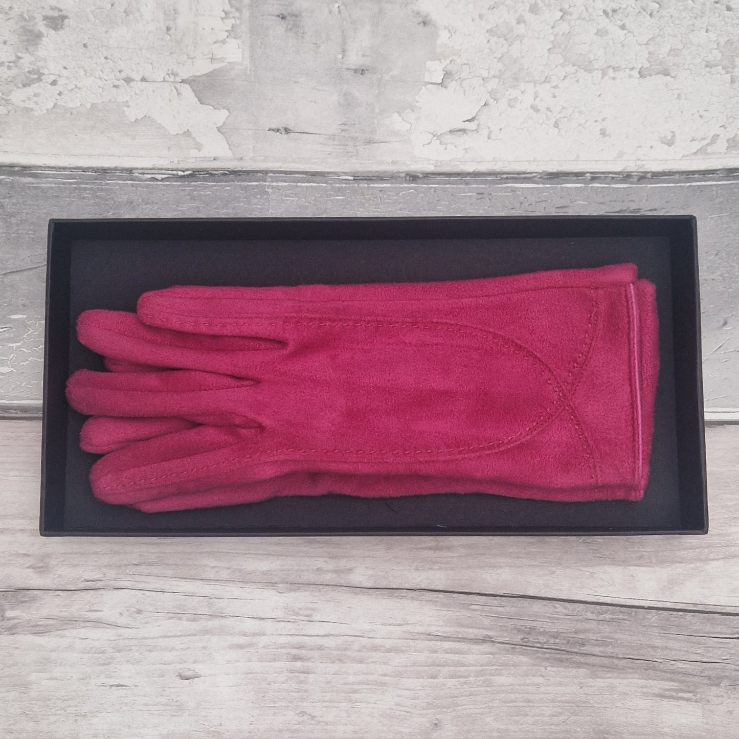 Hot Pink suede feel glove in a black presentation gift box.