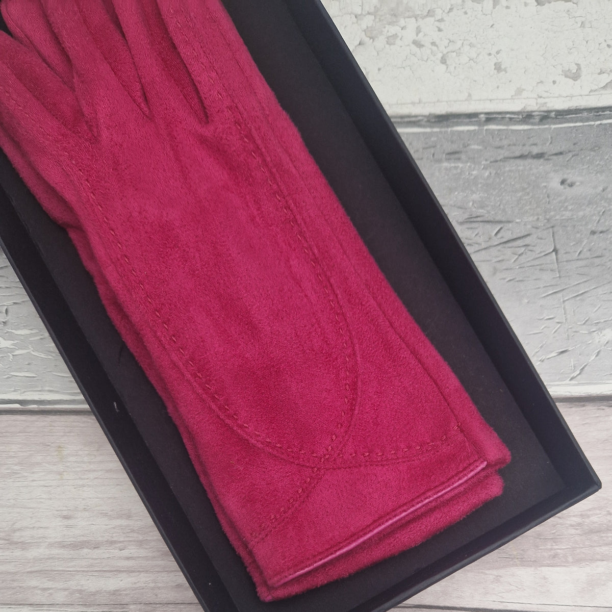 Hot Pink suede feel glove in a black presentation gift box.