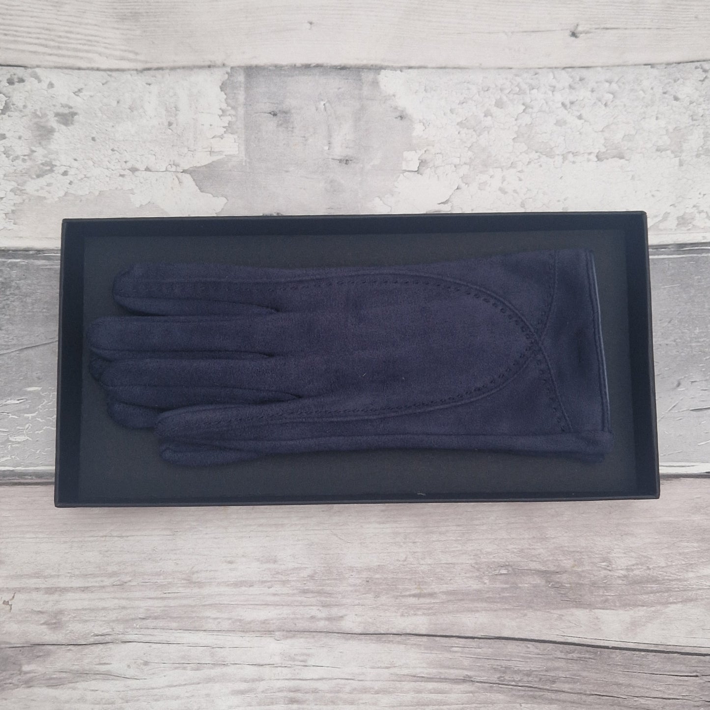 Navy Blue suede feel glove in a black presentation gift box.