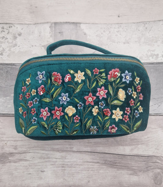 Turquoise velvet vanity case decorated with embroidered flowers of red, yellow and blue, finished with beads.