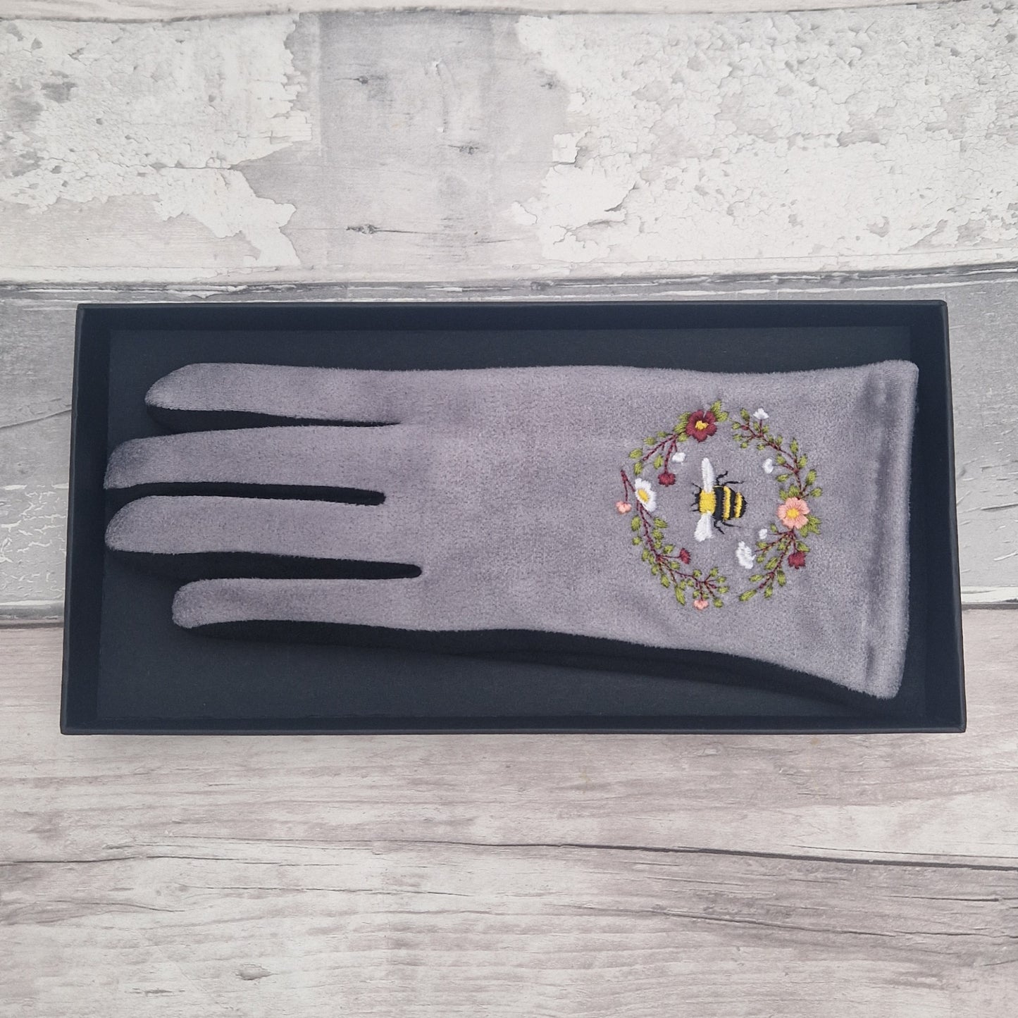 Grey and Black two tone gloves with an embroidered bee design in a gift box.