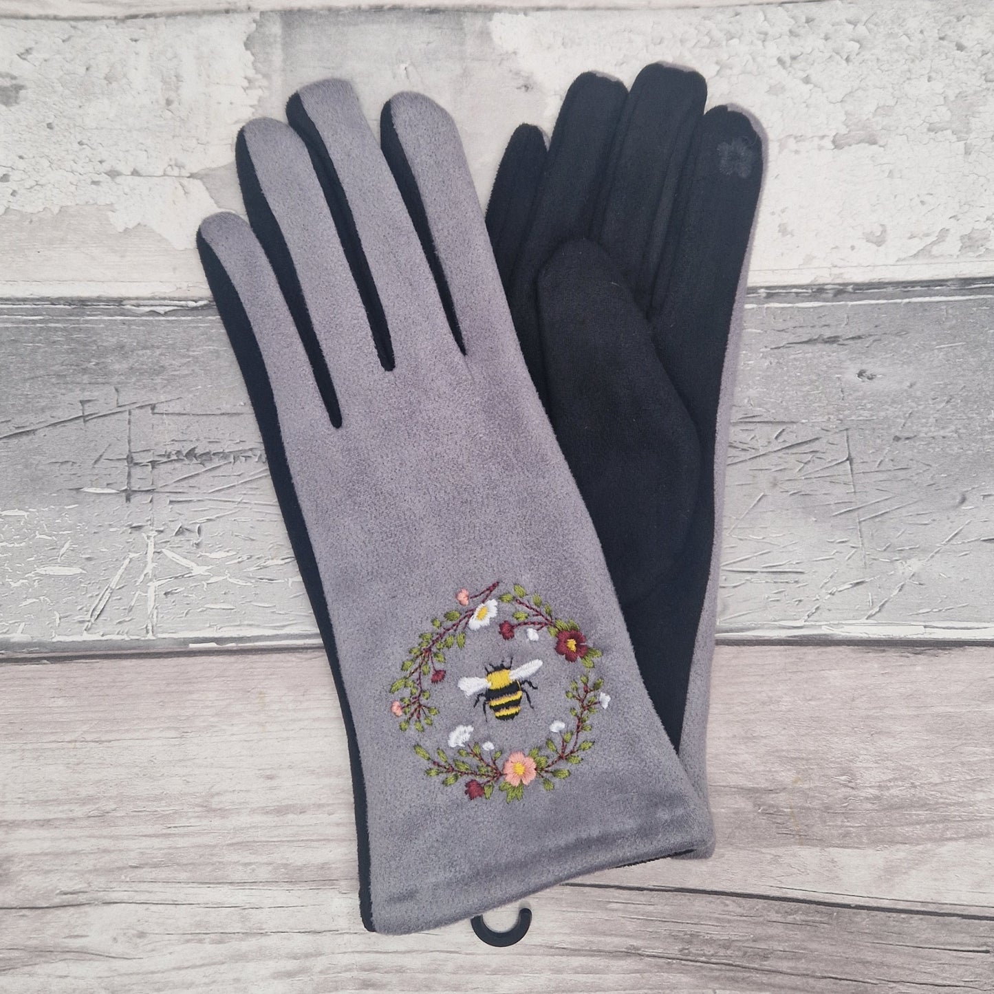 Grey and Black two tone gloves with an embroidered bee design.