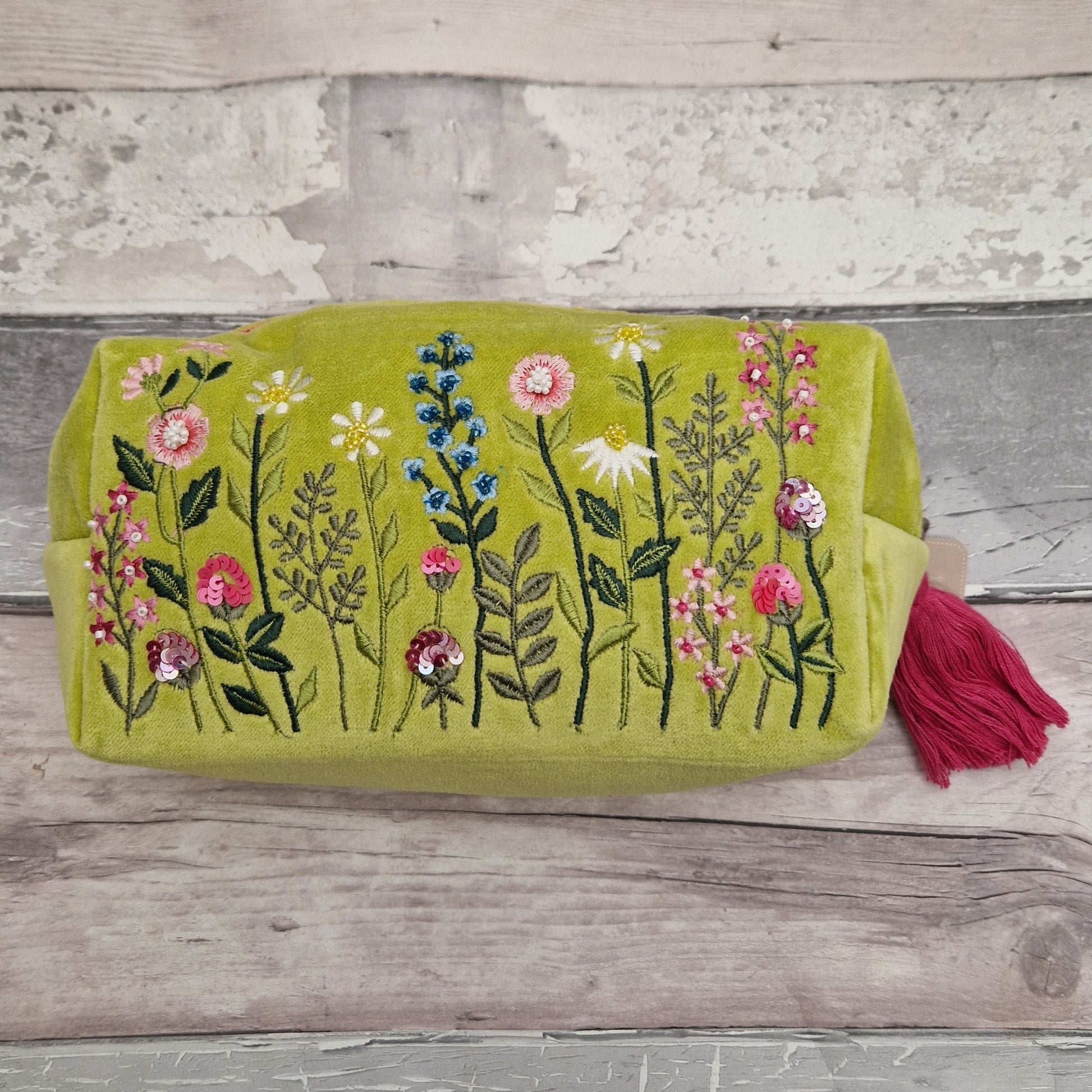 Lime green velvet toiletry bag decorated with embroidered flowers, finished with sequins and beads.