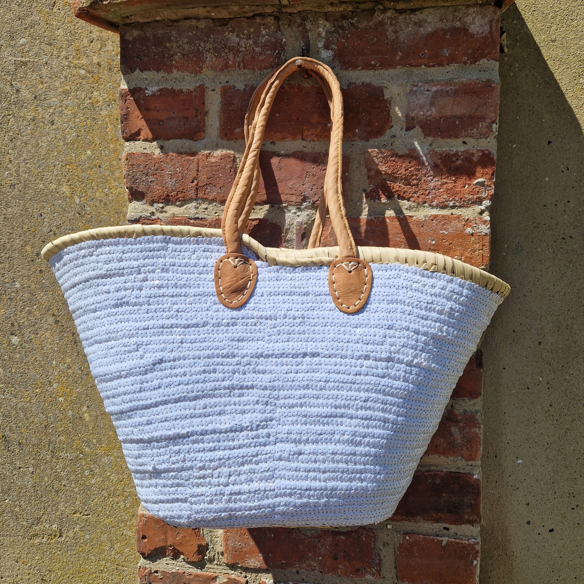 Morrocan hand woven basket with leather handles decorated with white sequins