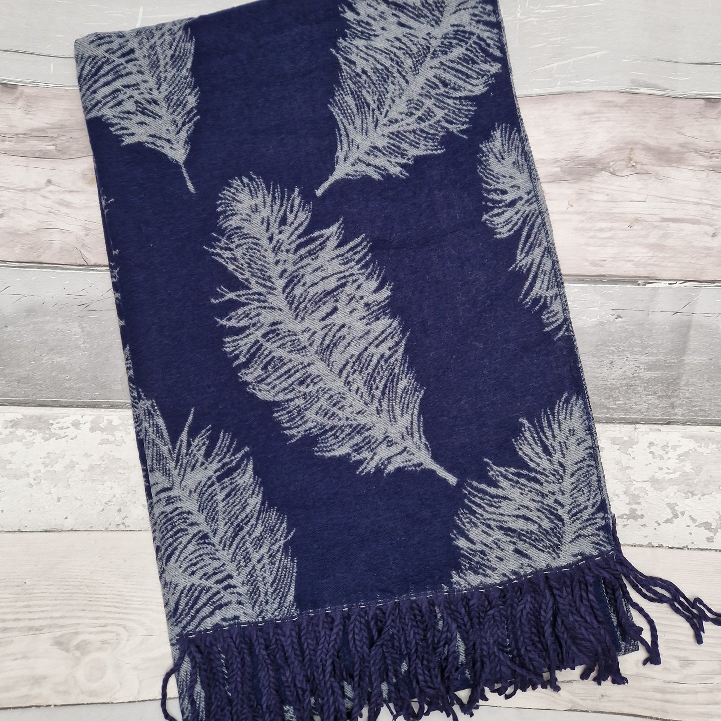 Navy and silver cashmere mix scarf in a large feather print.