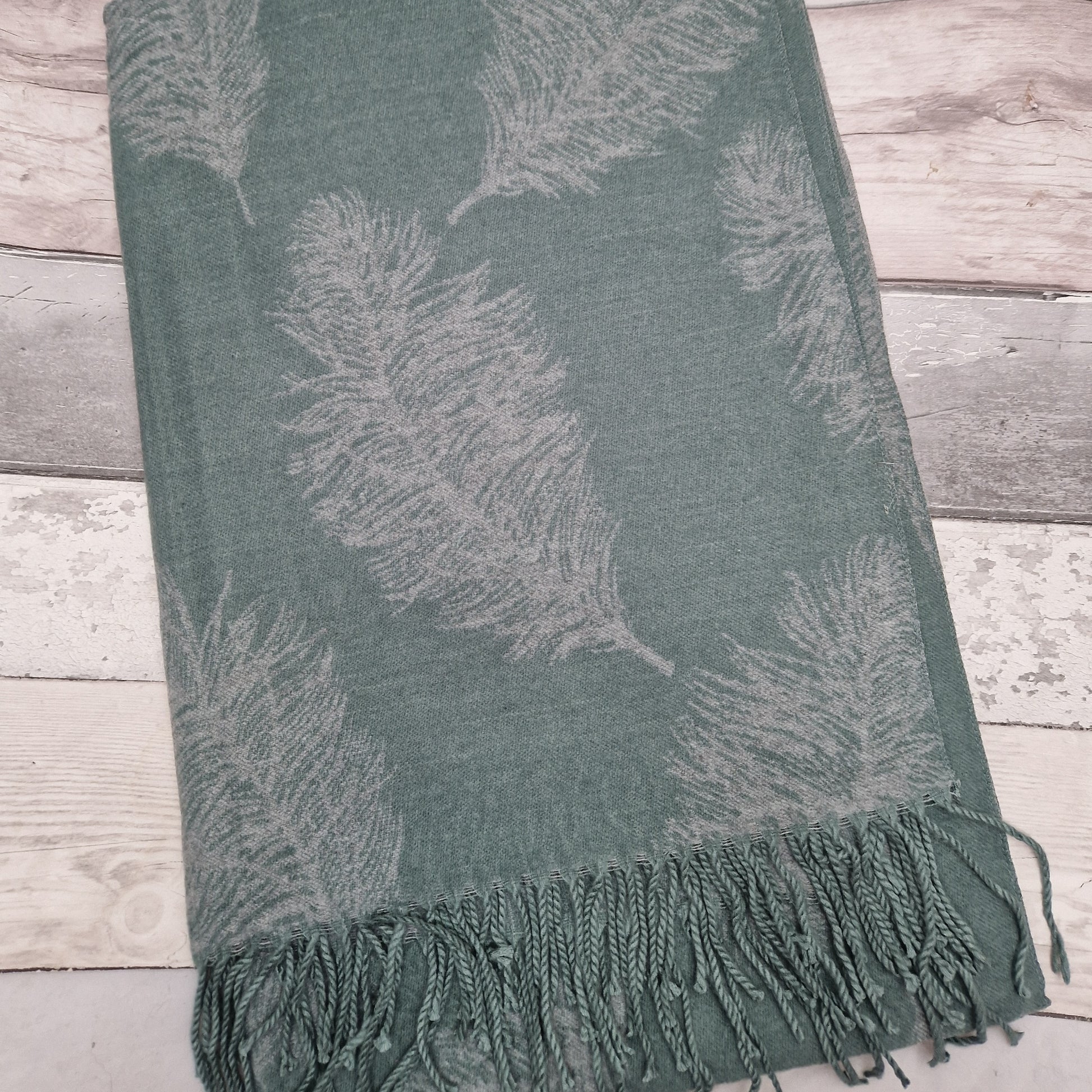 Feather print cashmere mix scarf in green and grey.