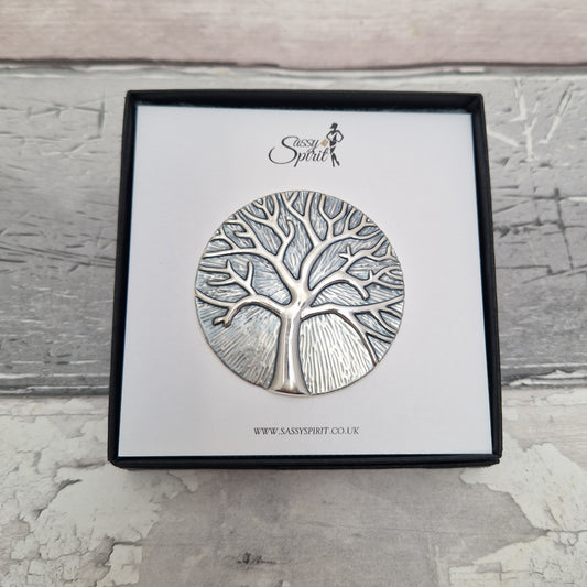 Silver tree-shaped brooch on a branded card with 'Sassy Spirit' logo.