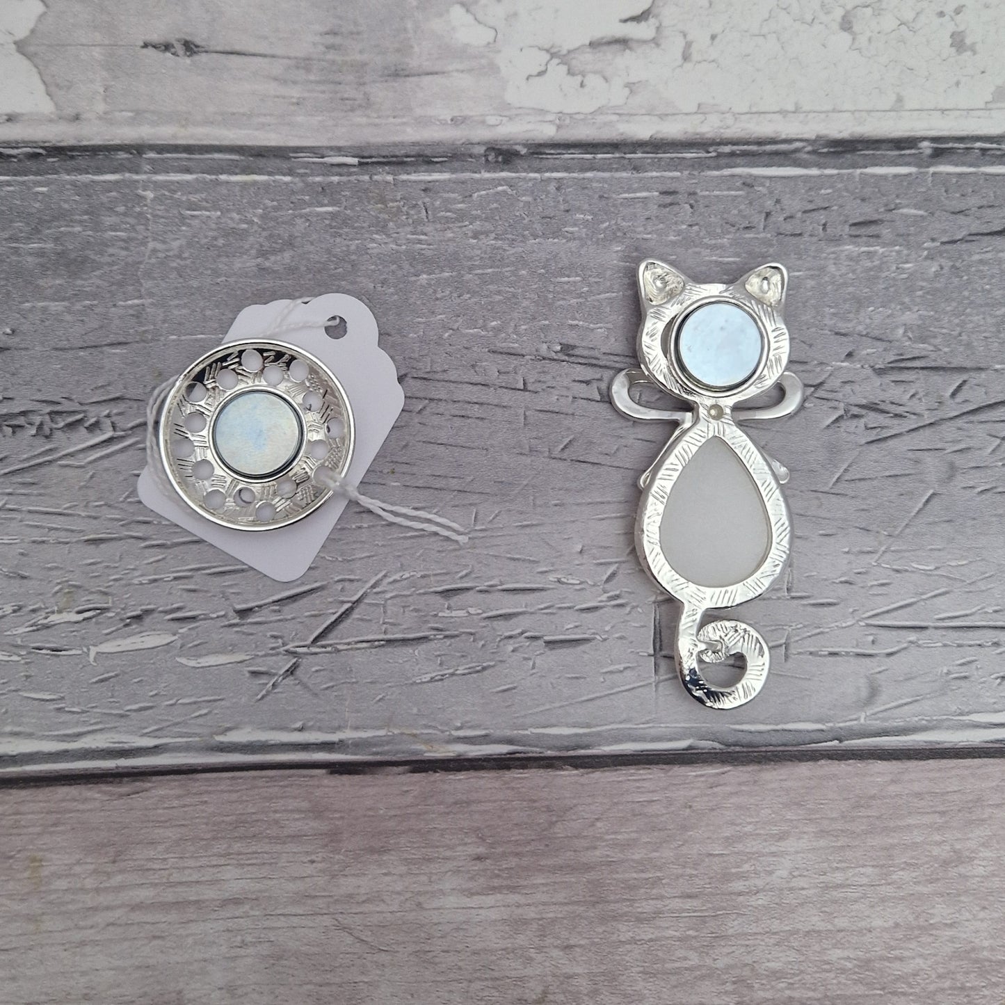 Reverse side of cat shaped magnetic brooch, showing magnets.
