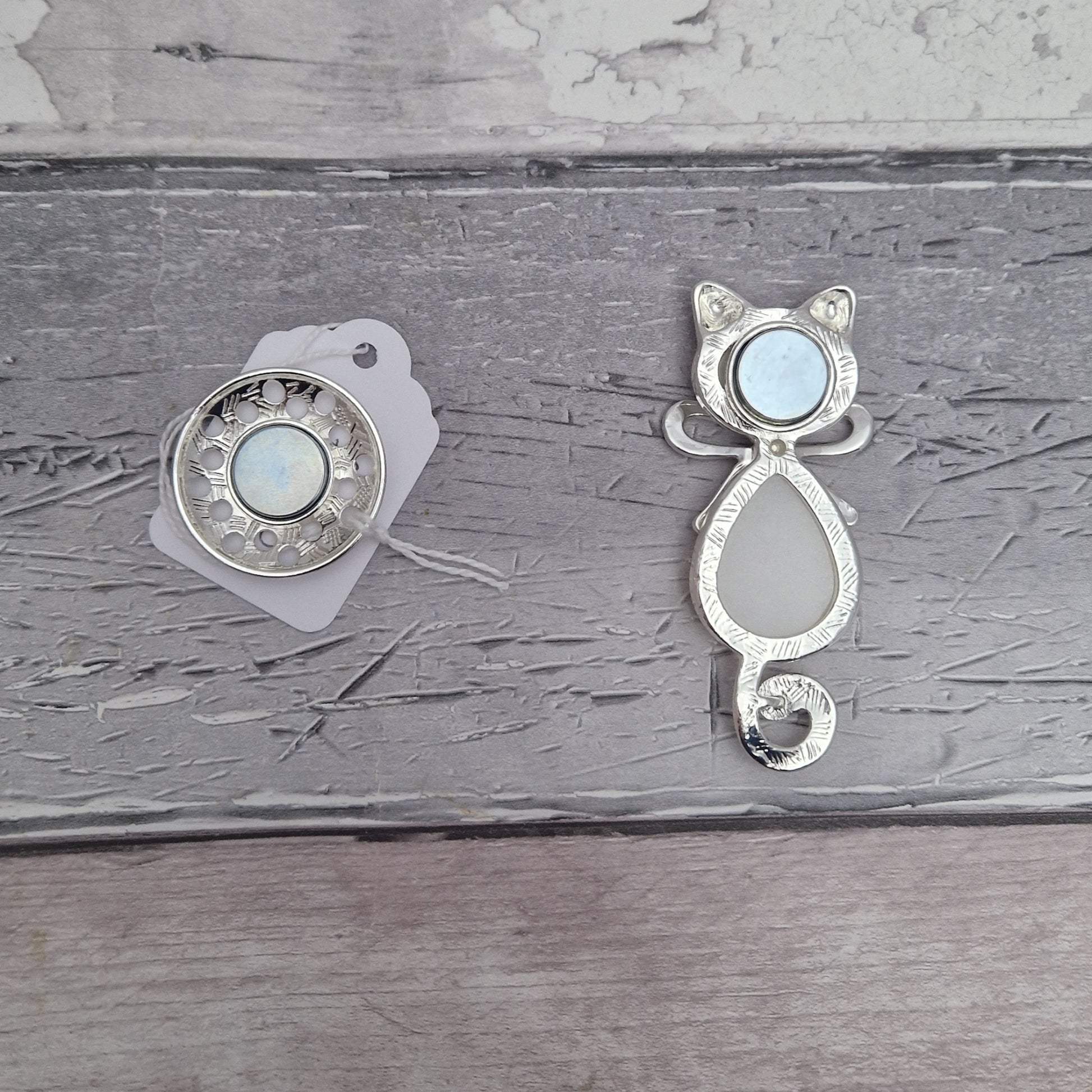 Reverse side of cat shaped magnetic brooch, showing magnets.