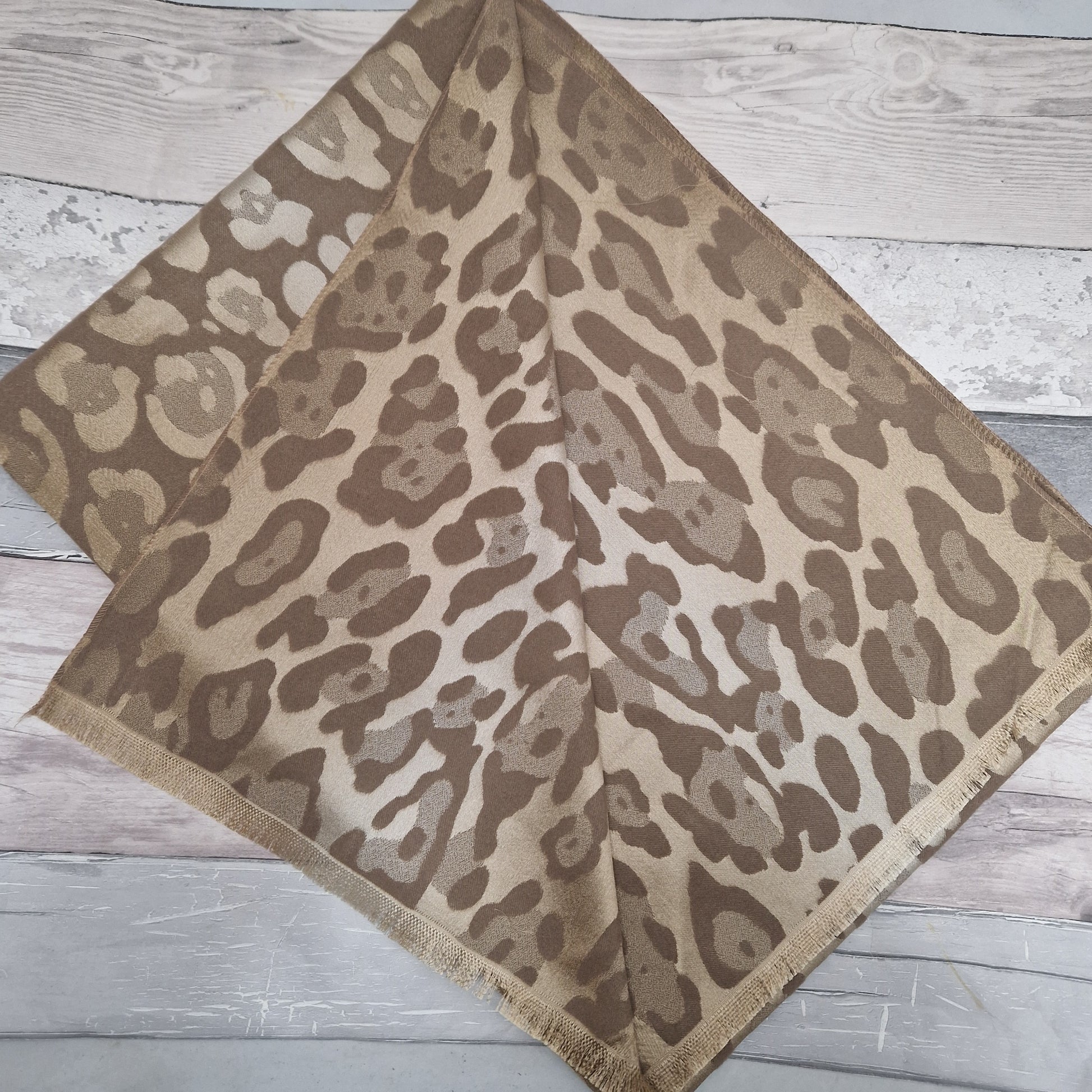 Shimmering Brown reversible Leopard print scarf.