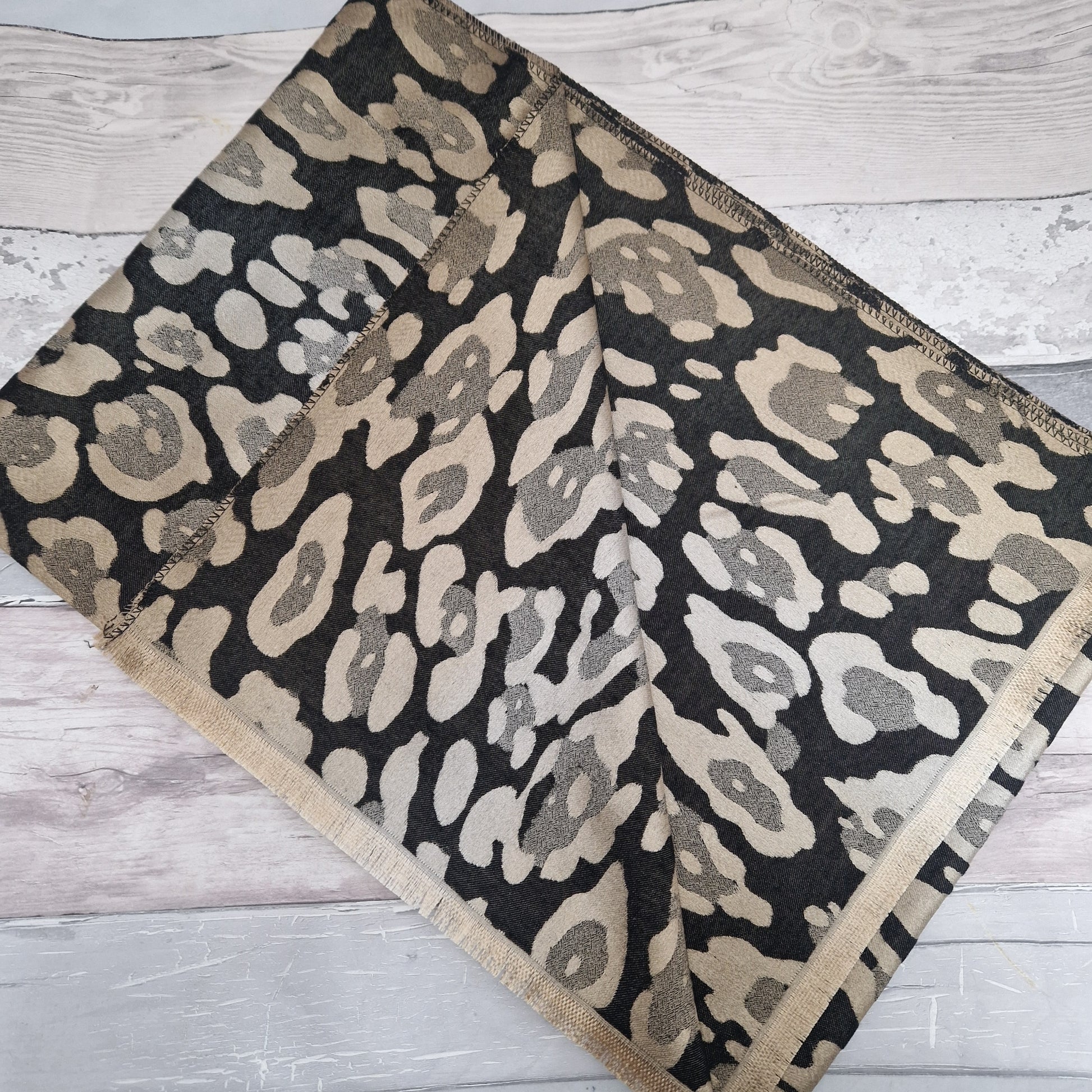Shimmering Black and Gold Leopard print scarf.