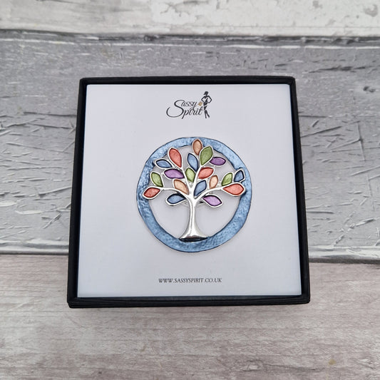 Tree-shaped brooch on a branded card with 'Sassy Spirit' logo.
