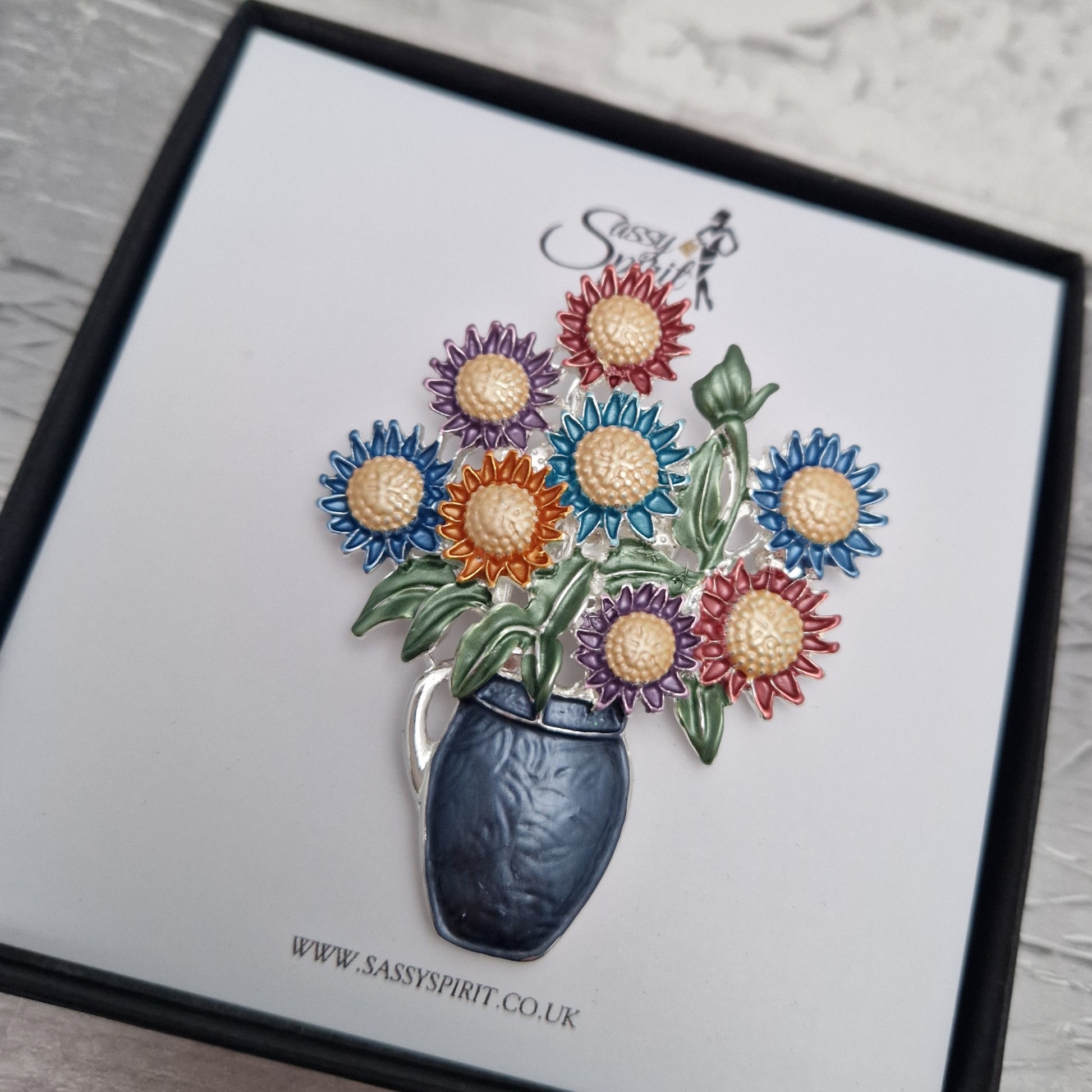 Floral brooch with a vase on a card from Sassy Spirit