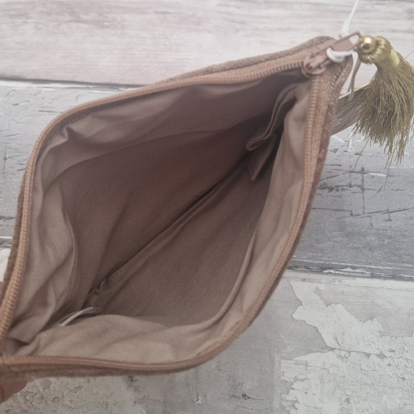 Inside view of a buff coloured pouch.