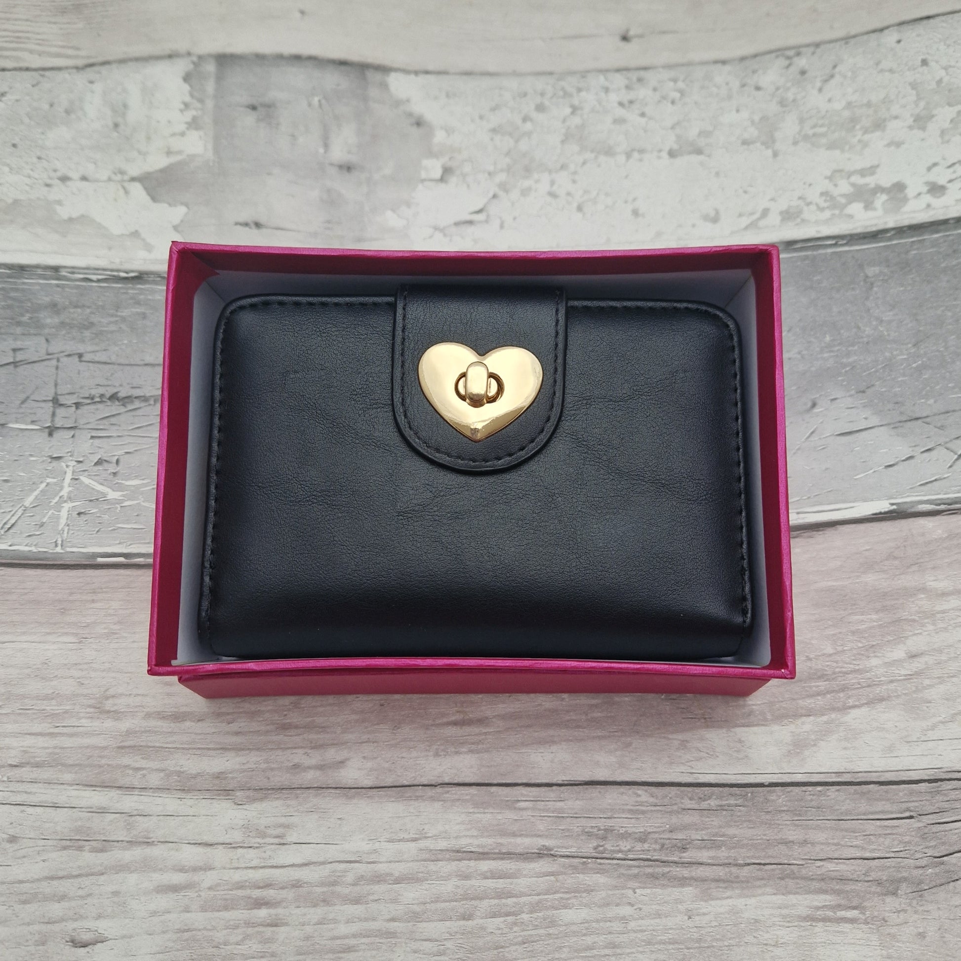 Black purse with love heart shaped closer