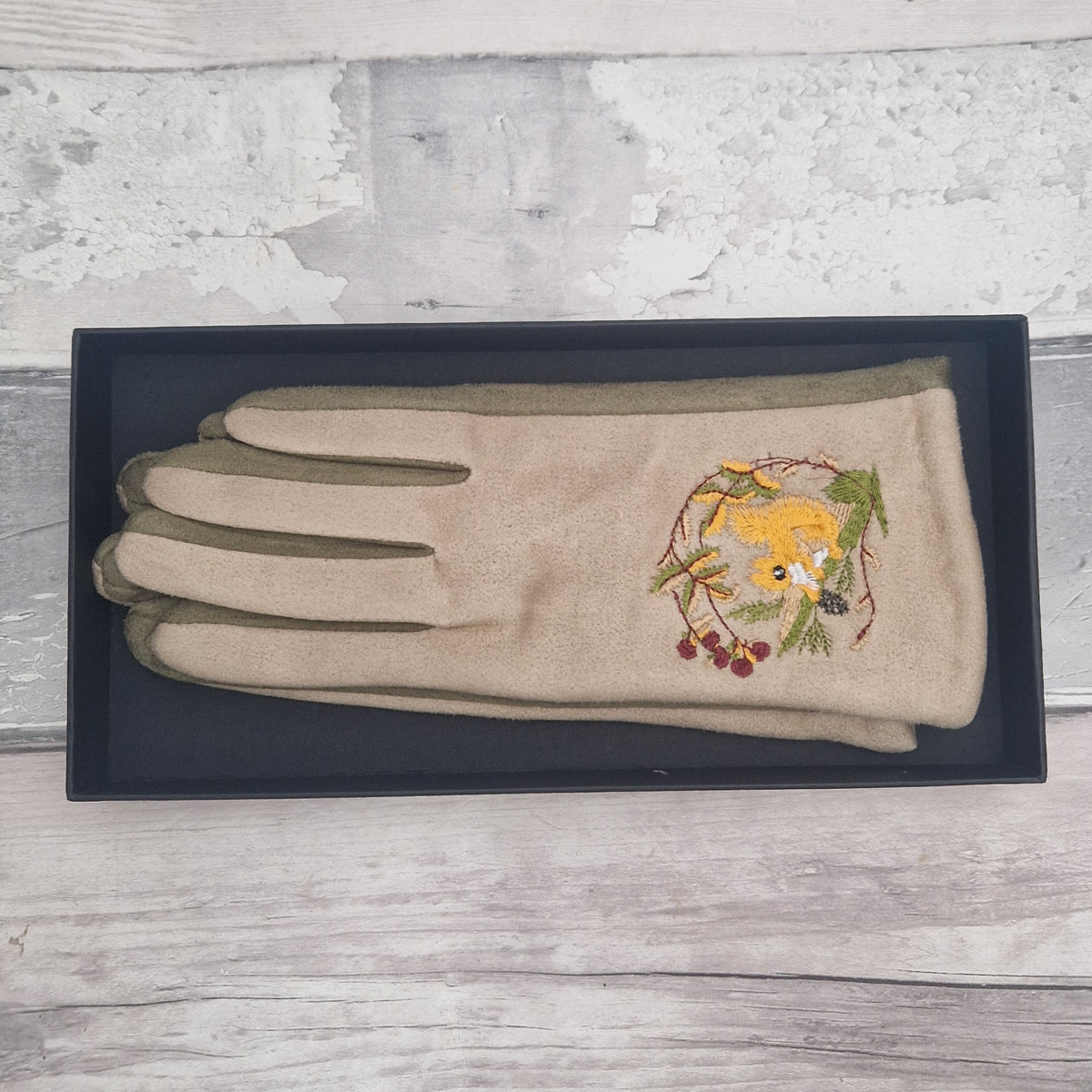 Beige gloves with embroidered red squirrel design in presentation gift box.