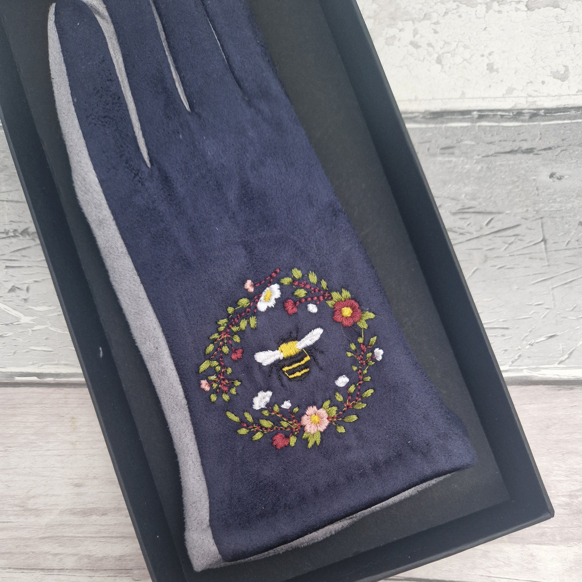 Grey and Navy two tone gloves with an embroidered bee design in gift box.
