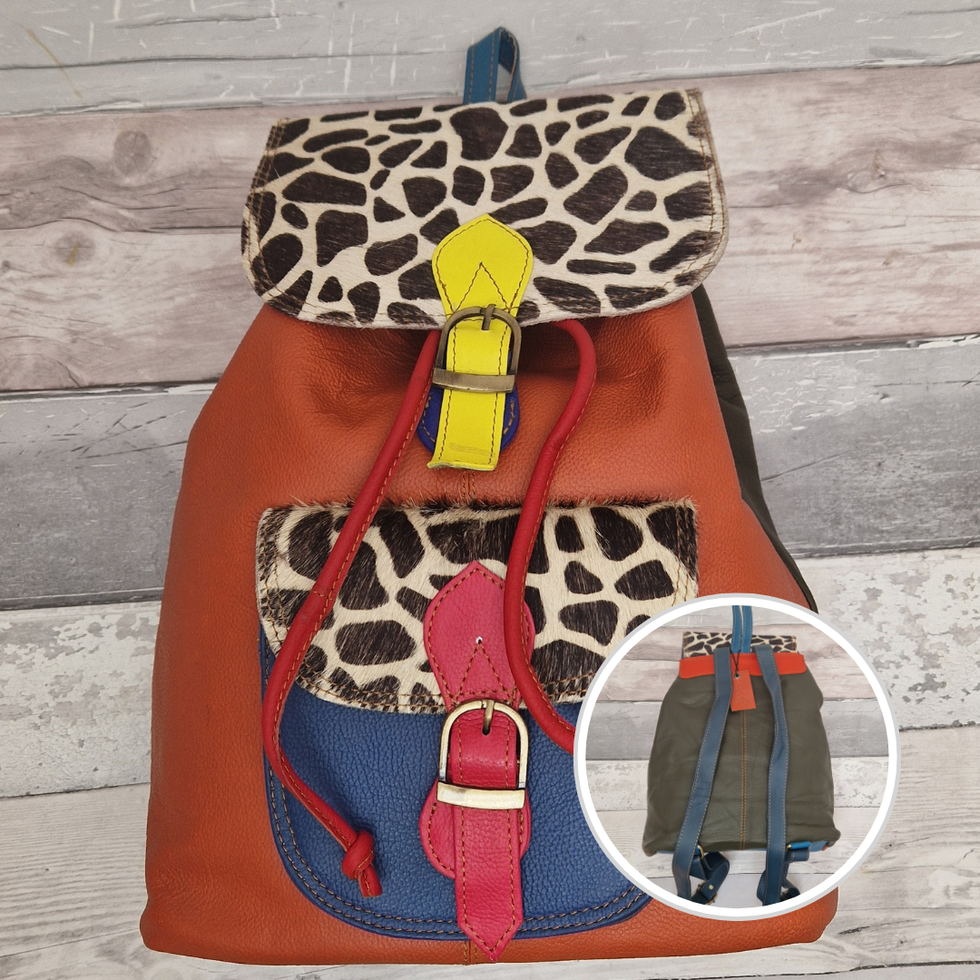 Rust Leather back pack with textured panels in black and white giraffe print.