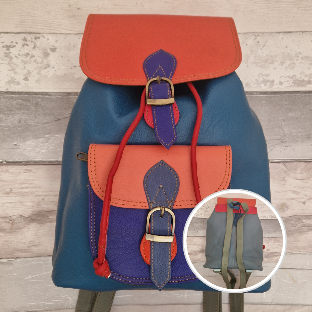 Multicolored backpack made from leather with front pocket and magnetic buckle closers. Blue and orange colours.