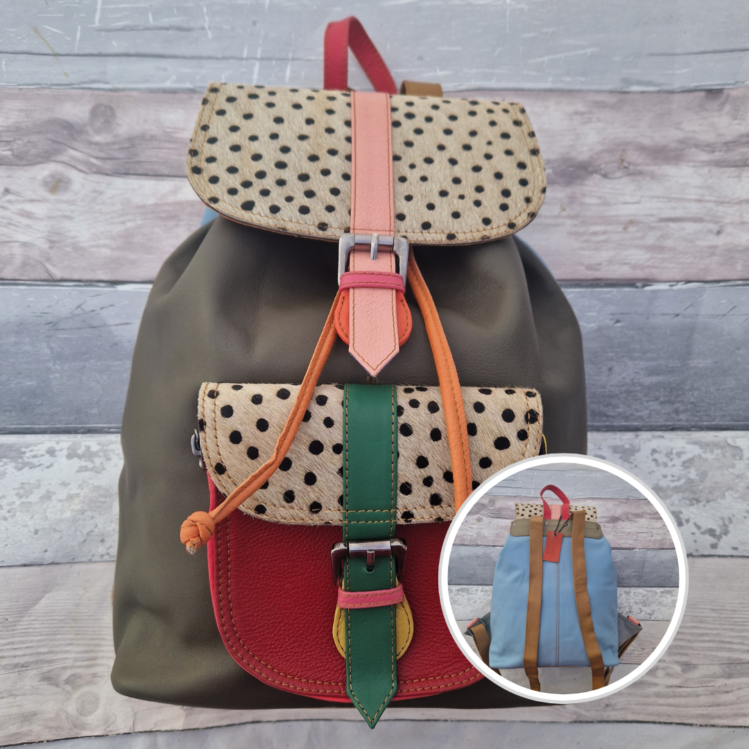 Multicolored backpack made from leather with front pocket and magnetic buckle closers. Olive Green and red colours with textured spot print panels.