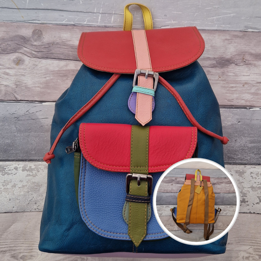 Multicolored backpack made from leather with front pocket and magnetic buckle closers. Blue, pink and green colours.