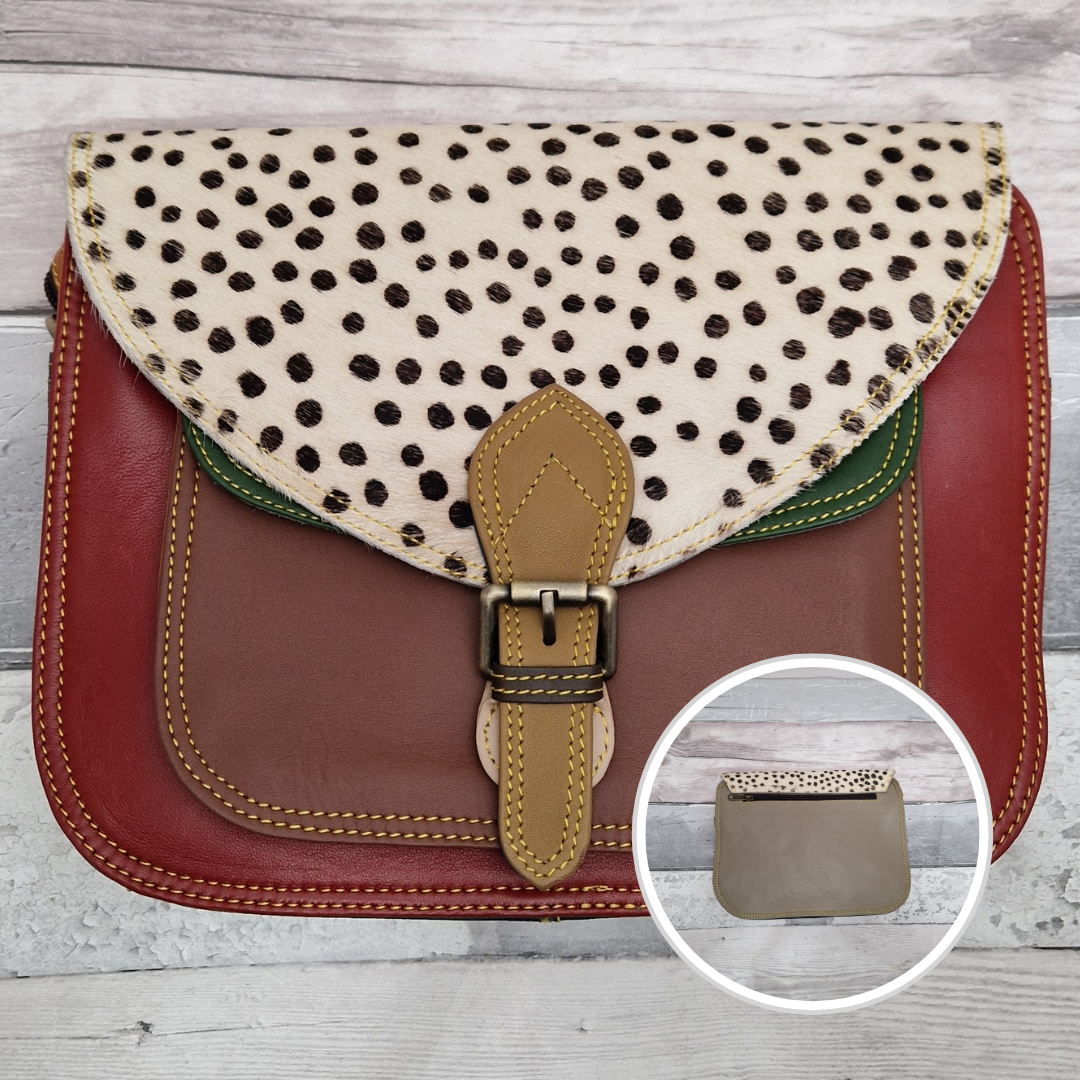 Large Saddlebag style leather crossbody bag. Multicoloured panels of red, green and brown finished with a spot print textured flap.