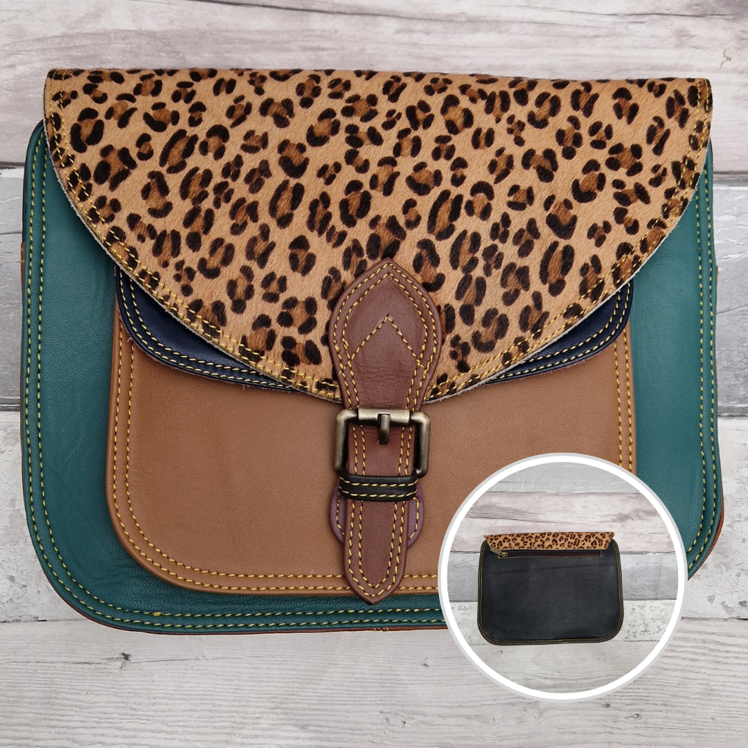Large Saddlebag style leather crossbody bag. Multicoloured panels of tan, turquoise and navy finished with a leopard print textured flap.