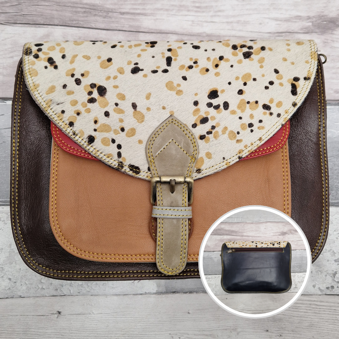 Large Saddlebag style leather crossbody bag. Multicoloured panels of dark brown, buff and red finished with a spot print textured flap.
