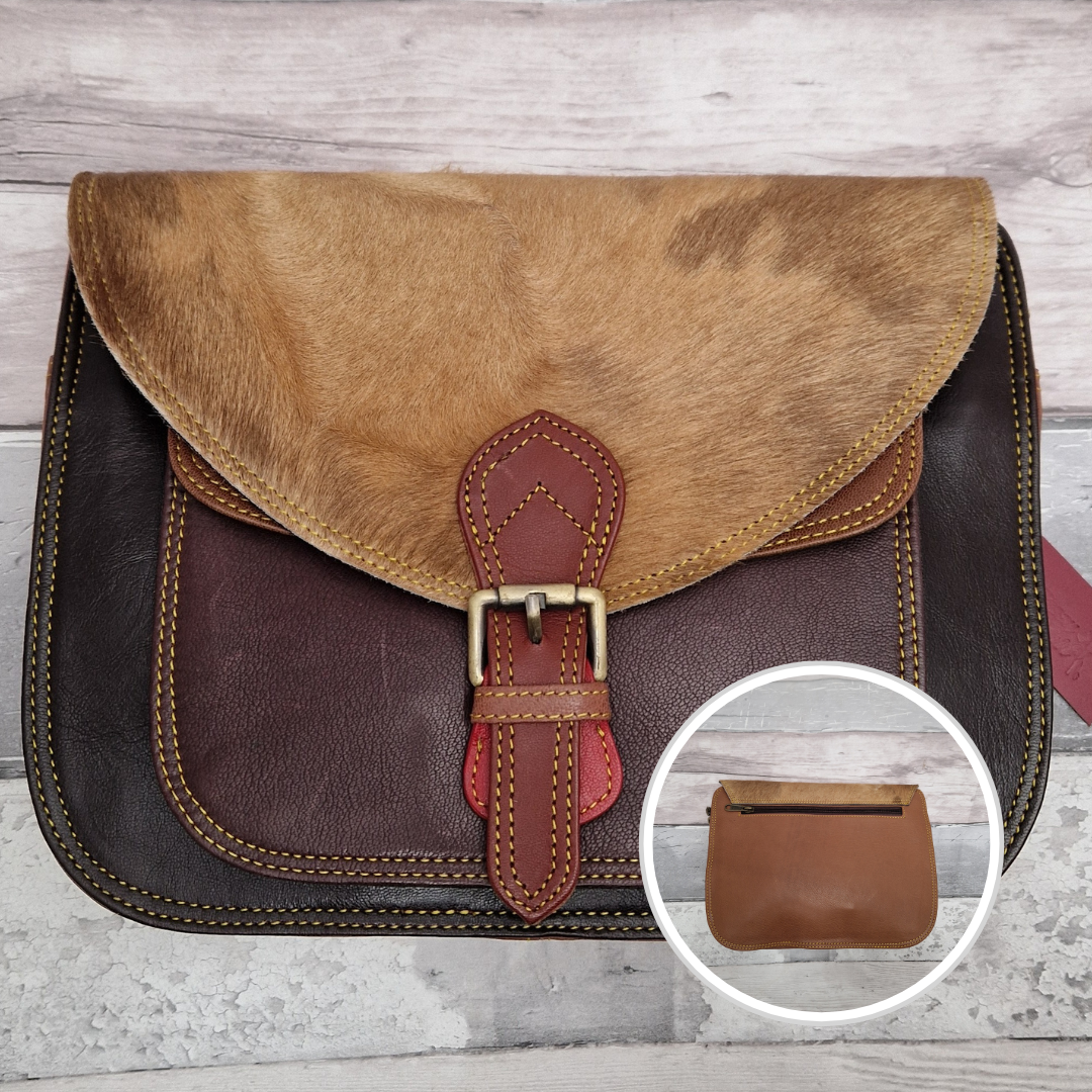 Large Saddlebag style leather crossbody bag. Multicoloured panels of browns and burgundy finished with a fox print textured flap.